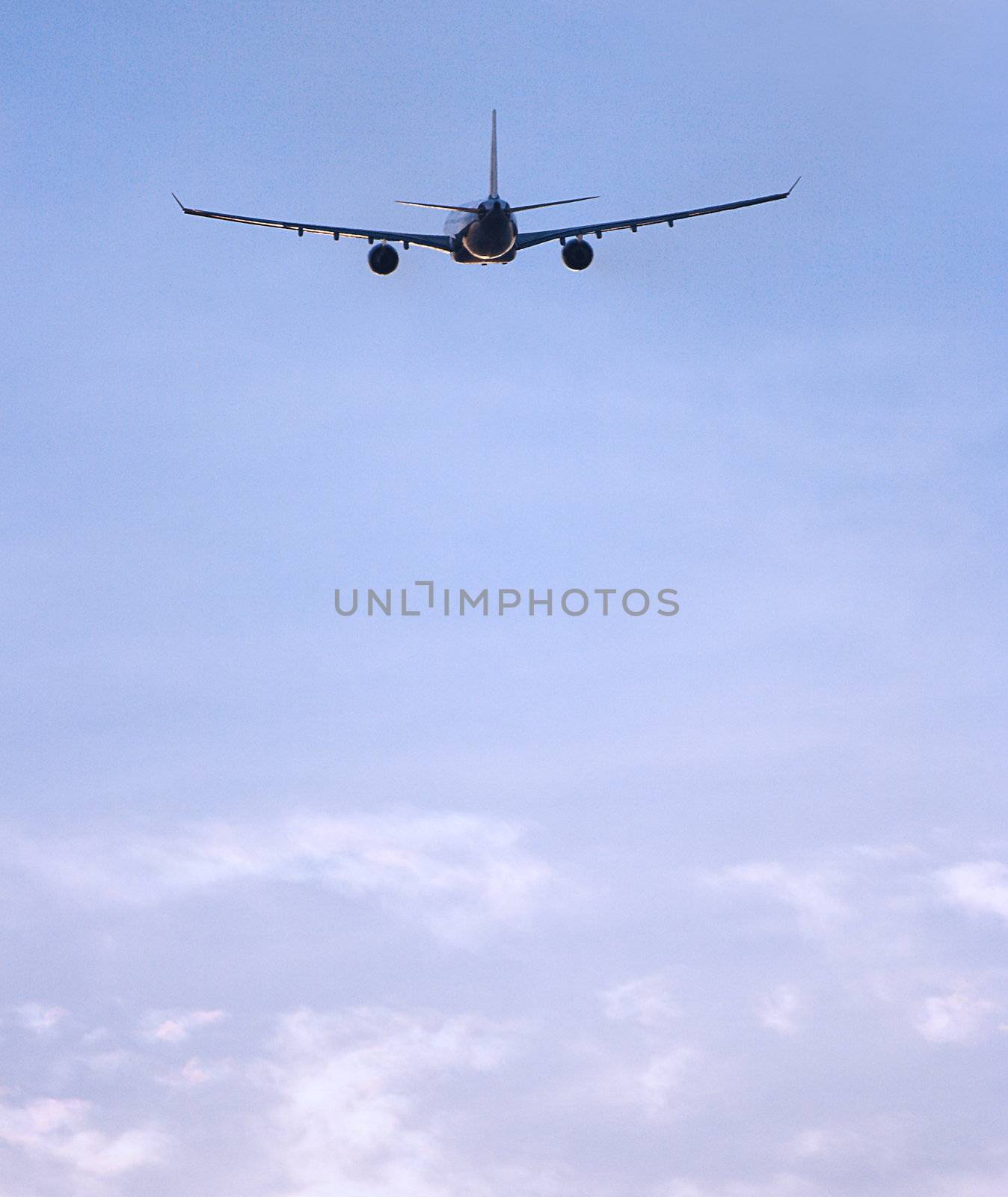 Airplane Flying In A Blue Sky by stuartmiles