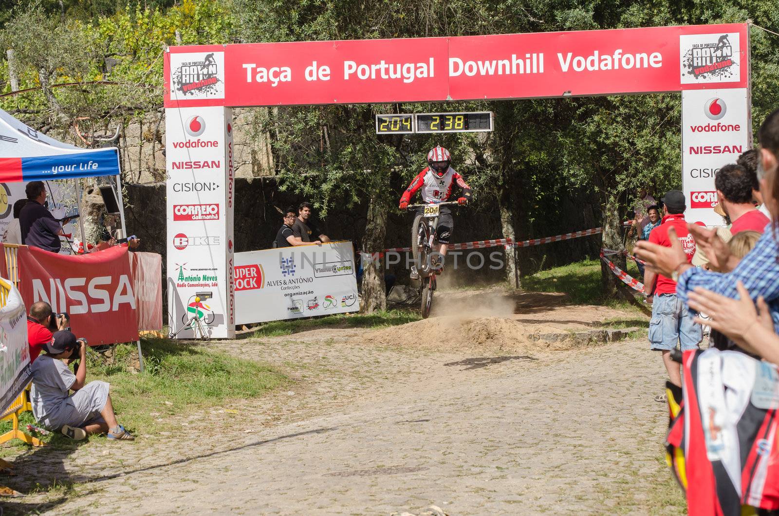 VIANA DO CASTELO, PORTUGAL - MAY 13: Joao Gois crossing the finish line on the 4th Stage of the Taca de Portugal Downhill Vodafone on may 13, 2012 in Viana do Castelo, Portugal.