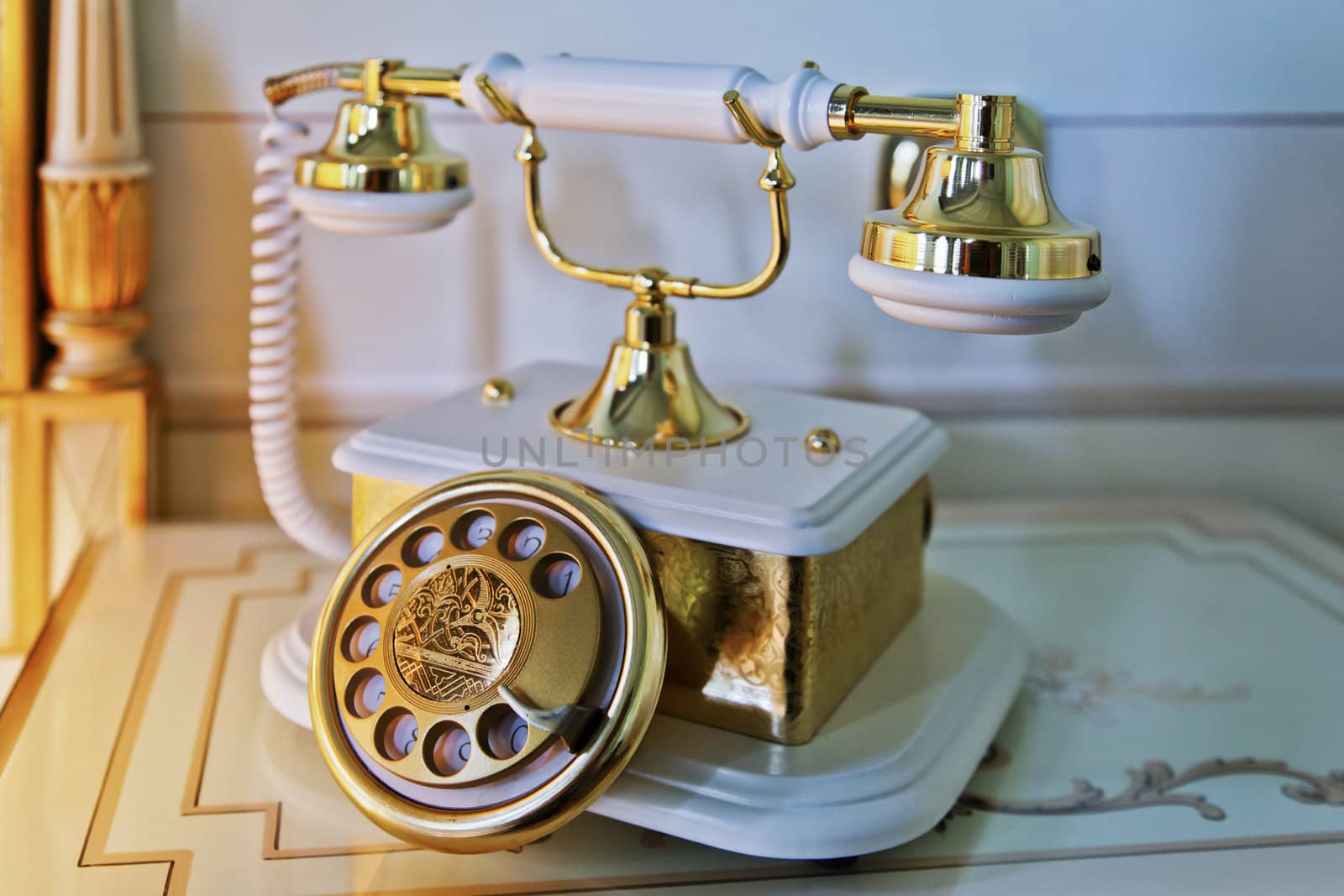 Horizontal shot of an old base and hand piece telephone in a luxurious room setting