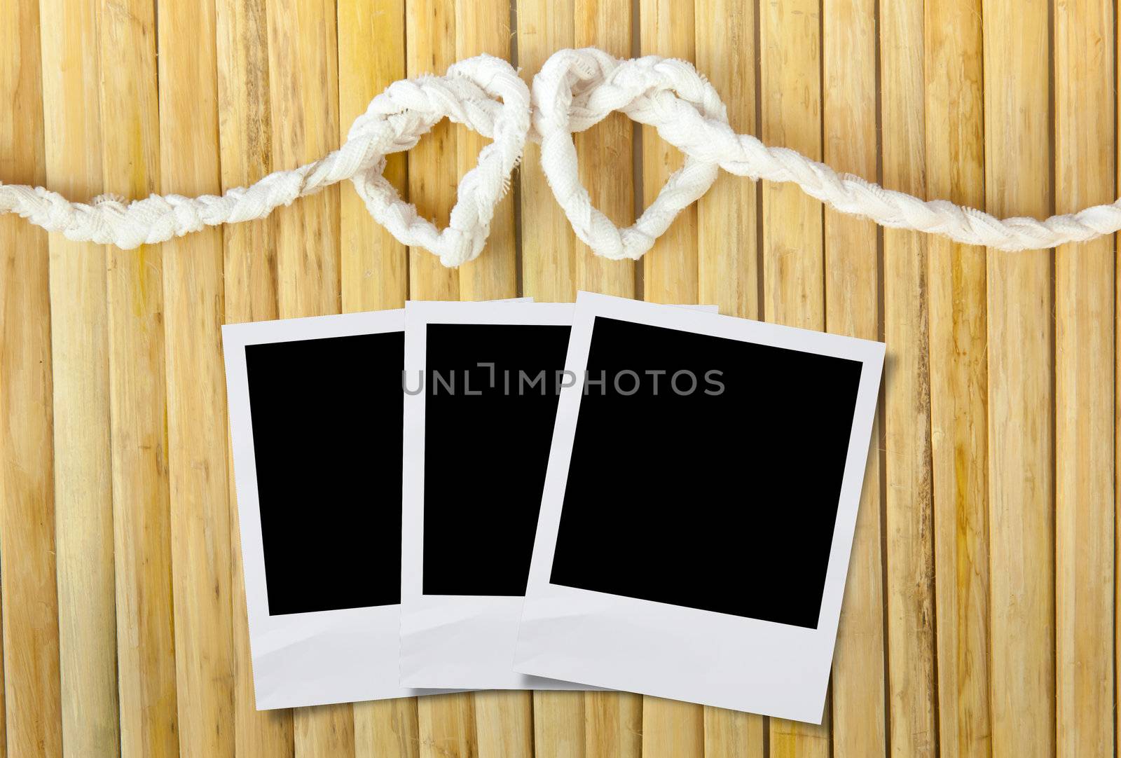 Rope in the shape of heart isolated on wood background