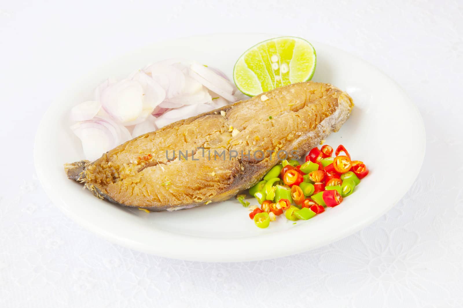 fish food on plate isolated on white background