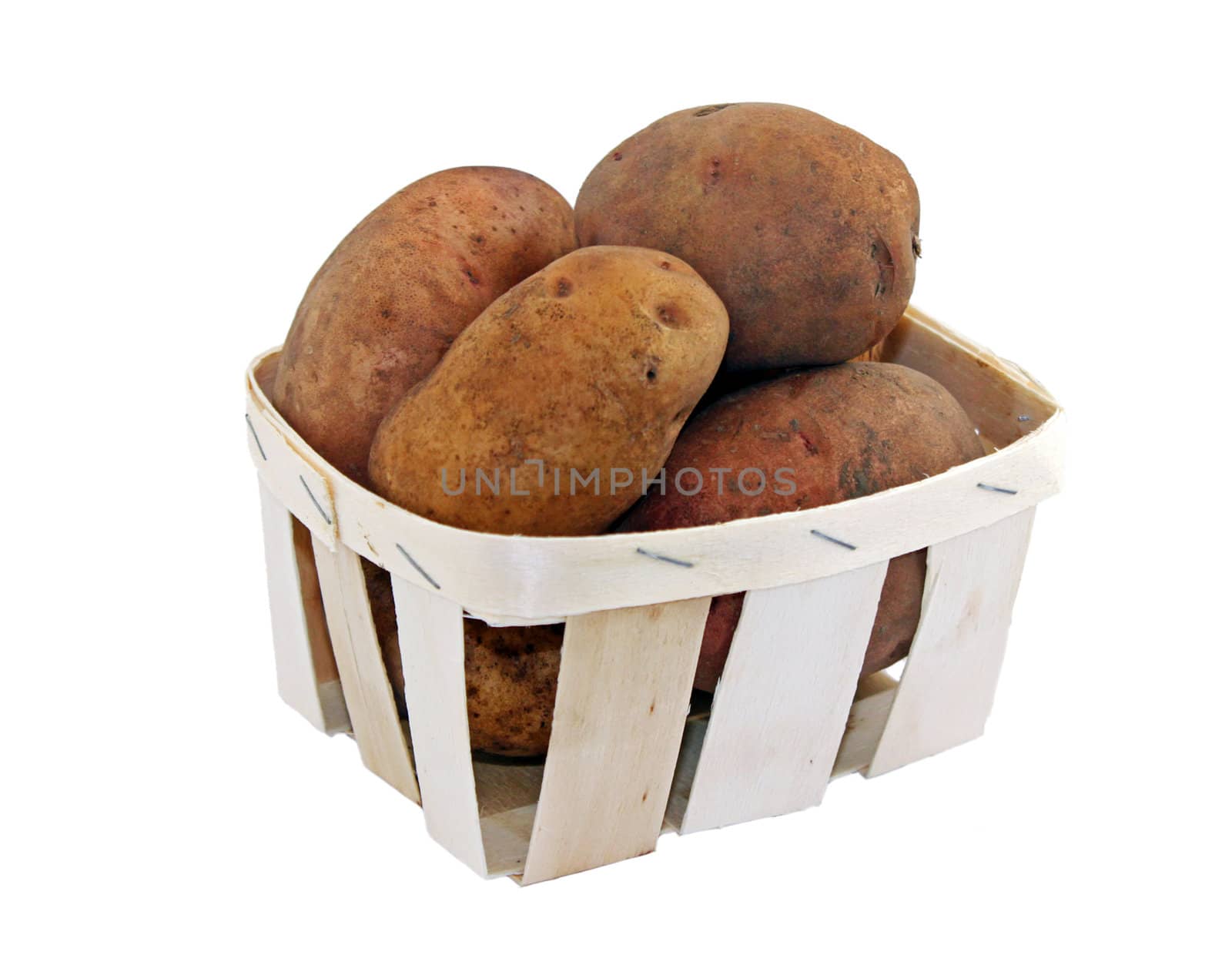 potatoes in a small basket isolated on white