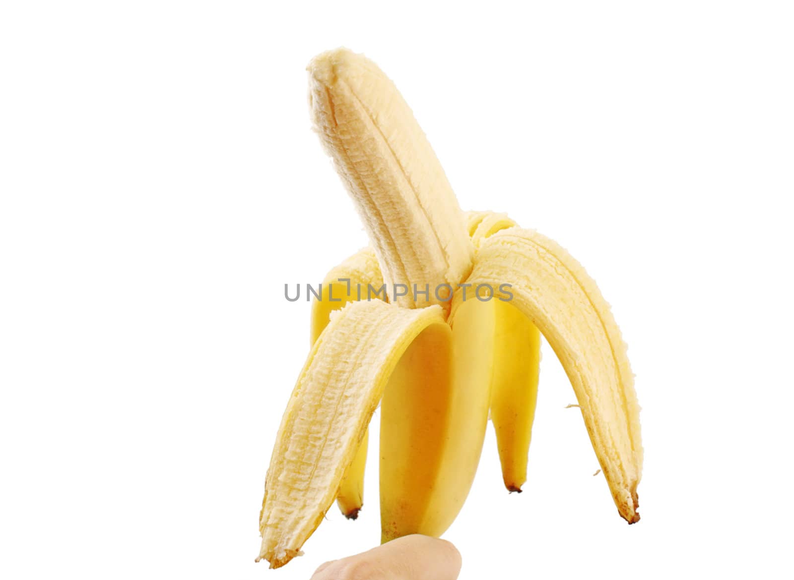 hand holding peeled banana over white