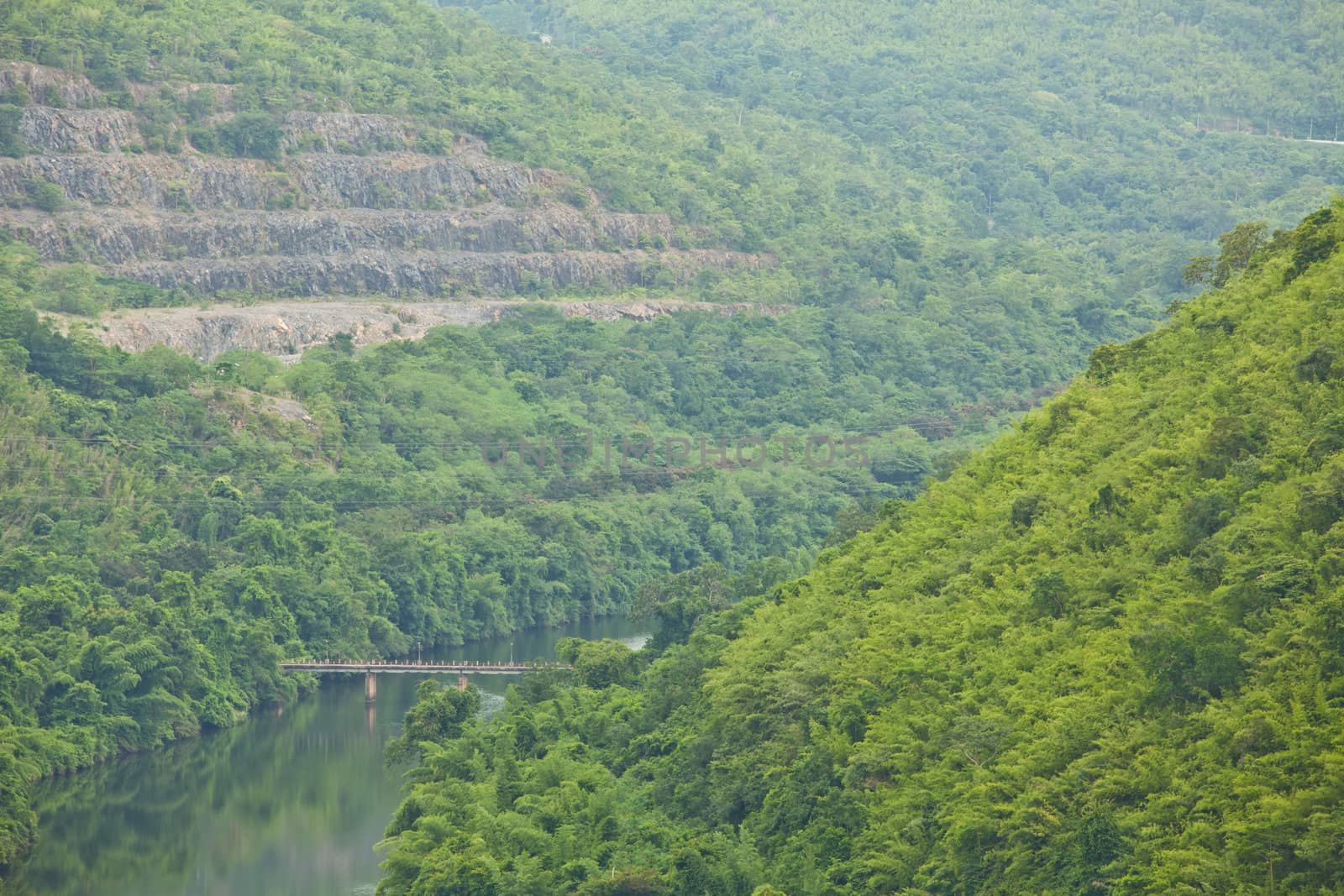 Bridge to the jungle mountain and river in Thailand