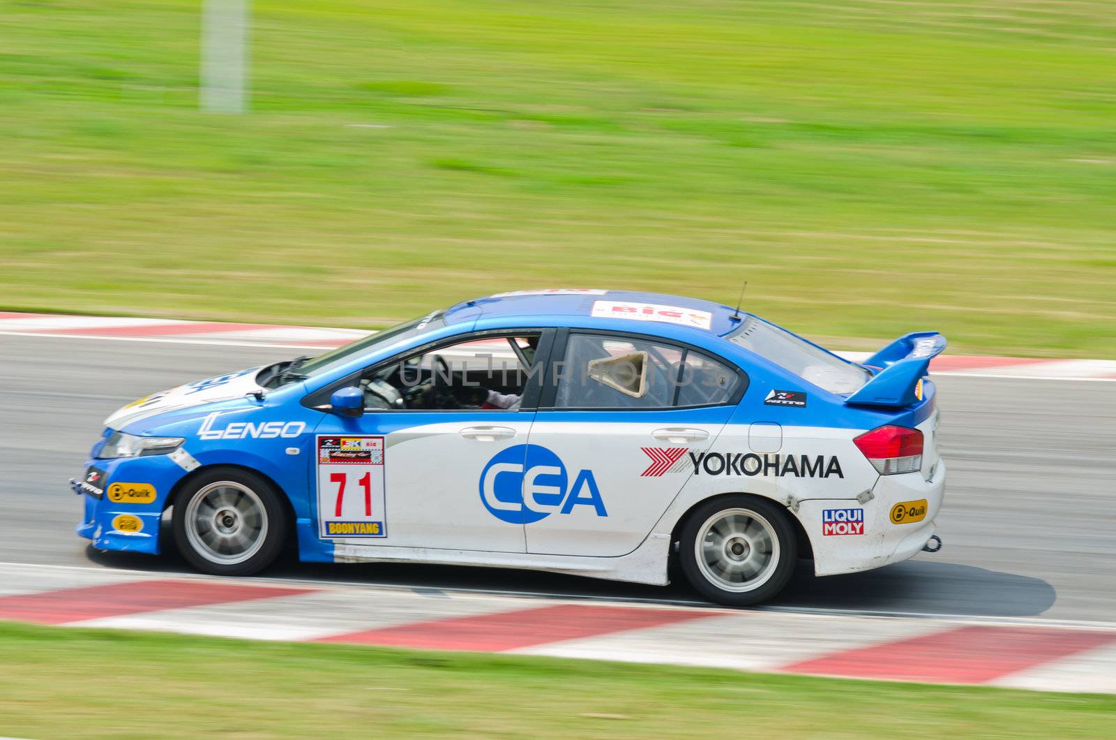 Nakhon Ratchasima, Thailand - March 9th:Unidentified car racing competitors during the "Thailand circuit 2013  " at Bonanza speedway on March 9th, 2013 in Nakhon Ratchasima, Thailand. 
