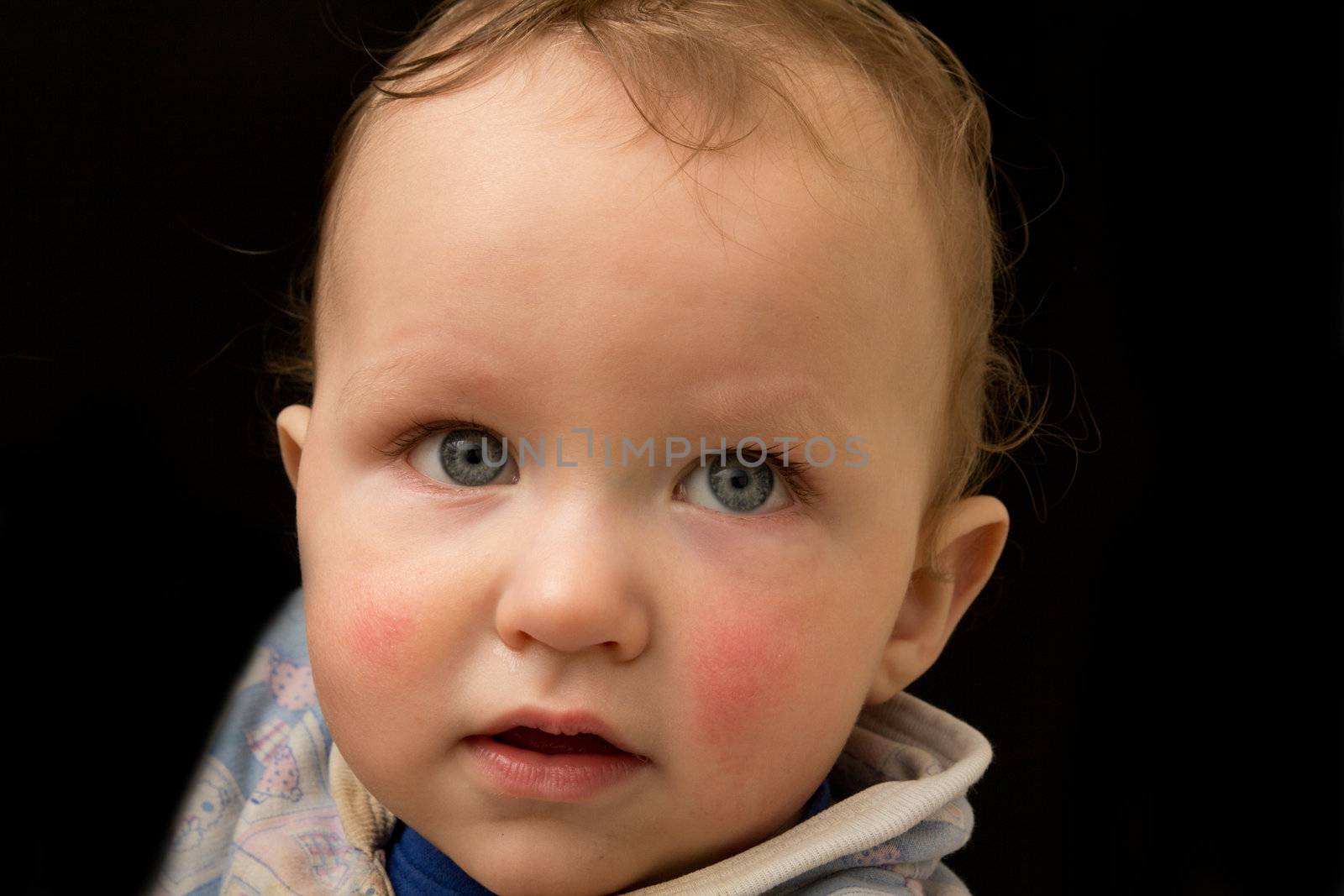 portrait of a boy baby on a black background by schankz