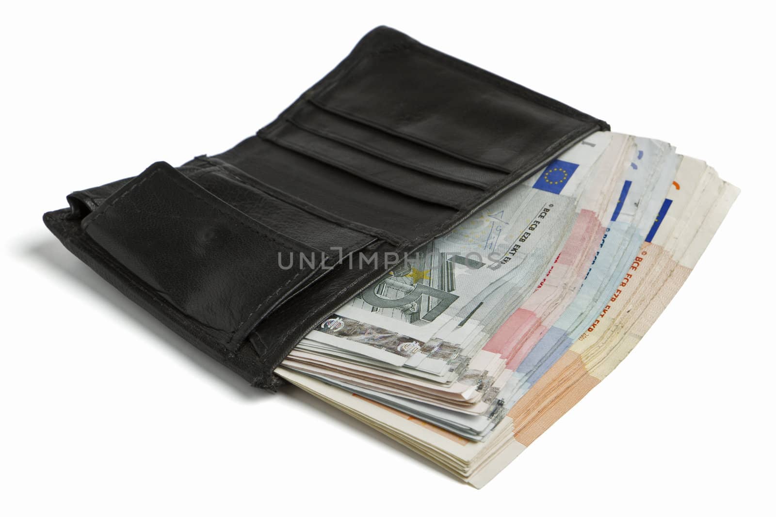 many banknotes in black wallet on light background