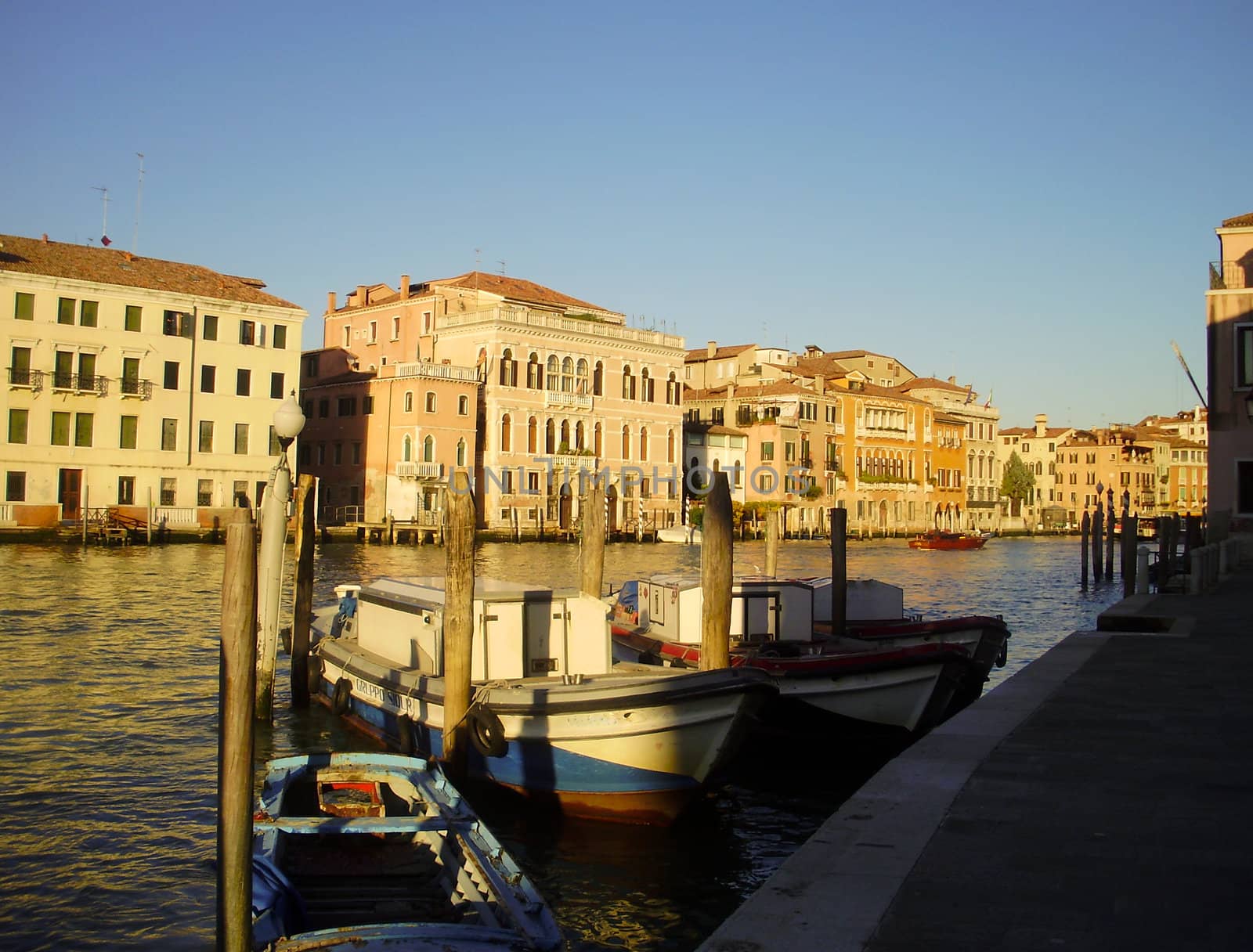 Boats tied alongisde the Grand Canal in Venice, Italy.