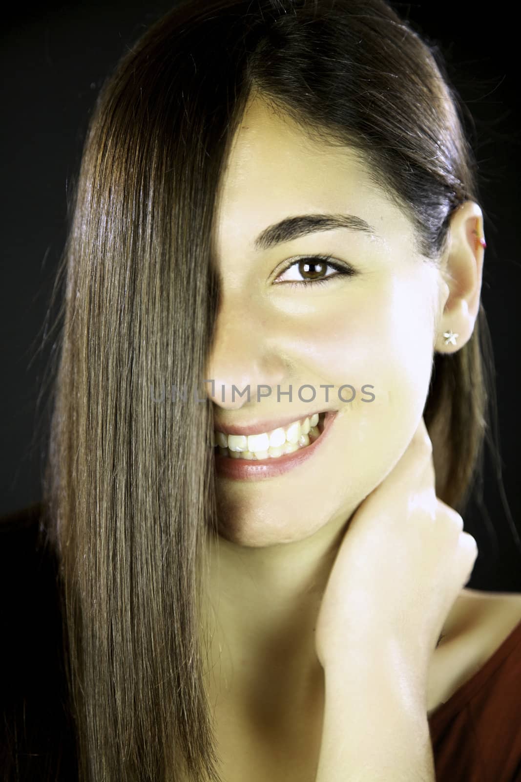 Young woman with gorgeous smile and amazing long straight hair