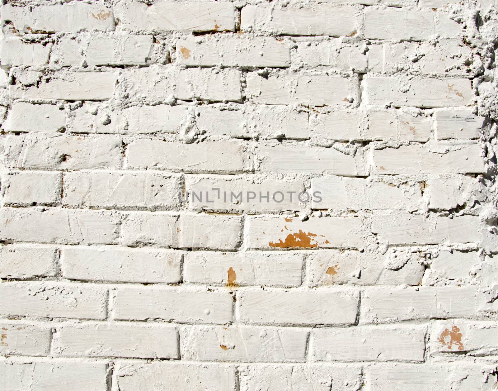 Background red brick wall painted white paint. Architectural backdrop.