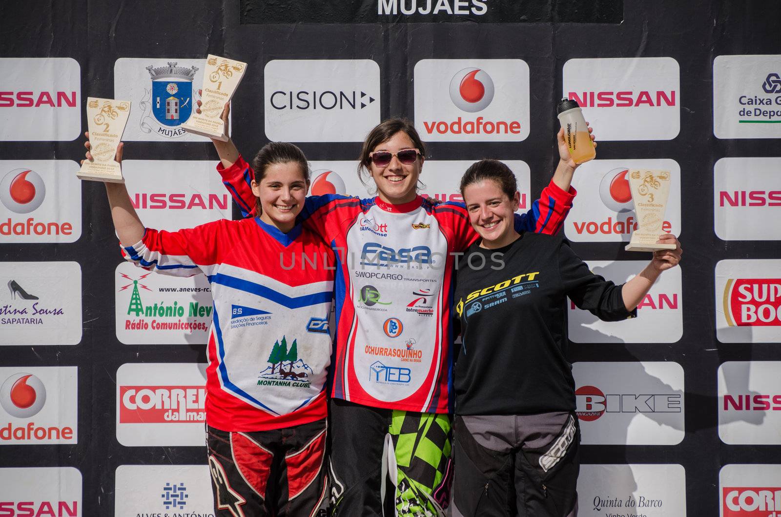 VIANA DO CASTELO, PORTUGAL - MAY 13: Elit Woman winner Filipa Peres in the middle at the podium on the 4th Stage of the Taca de Portugal Downhill Vodafone on may 13, 2012 in Viana do Castelo, Portugal.