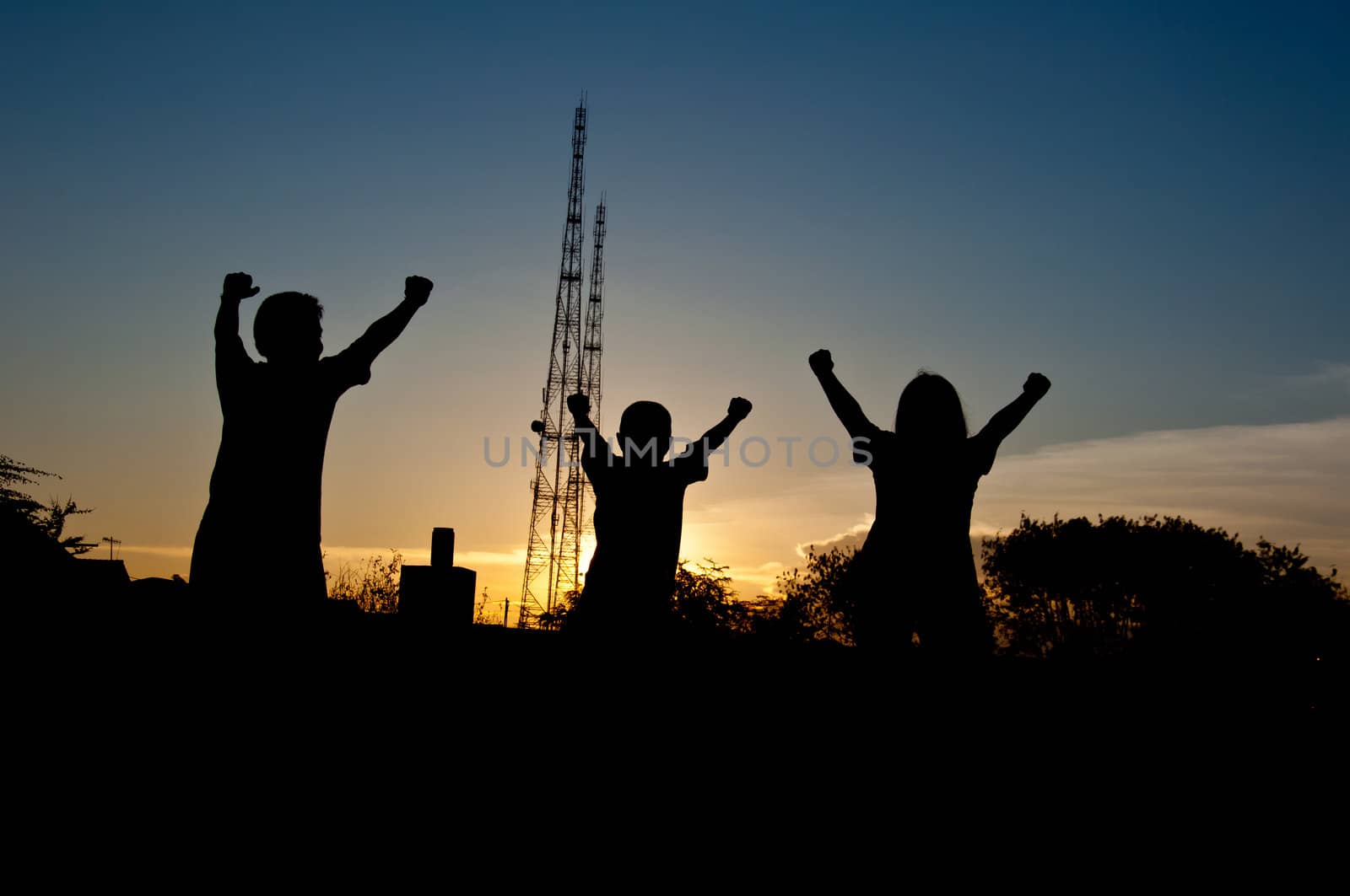 silhouette of children victory