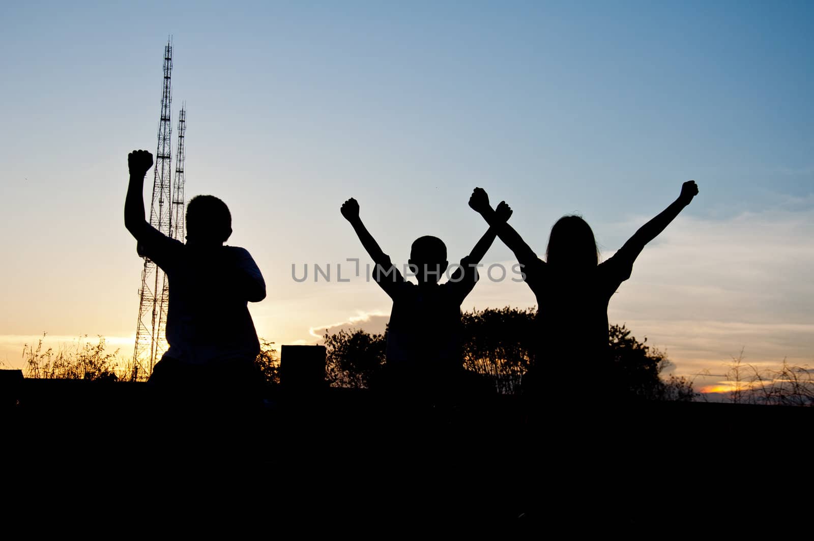 silhouette of children victory and happy