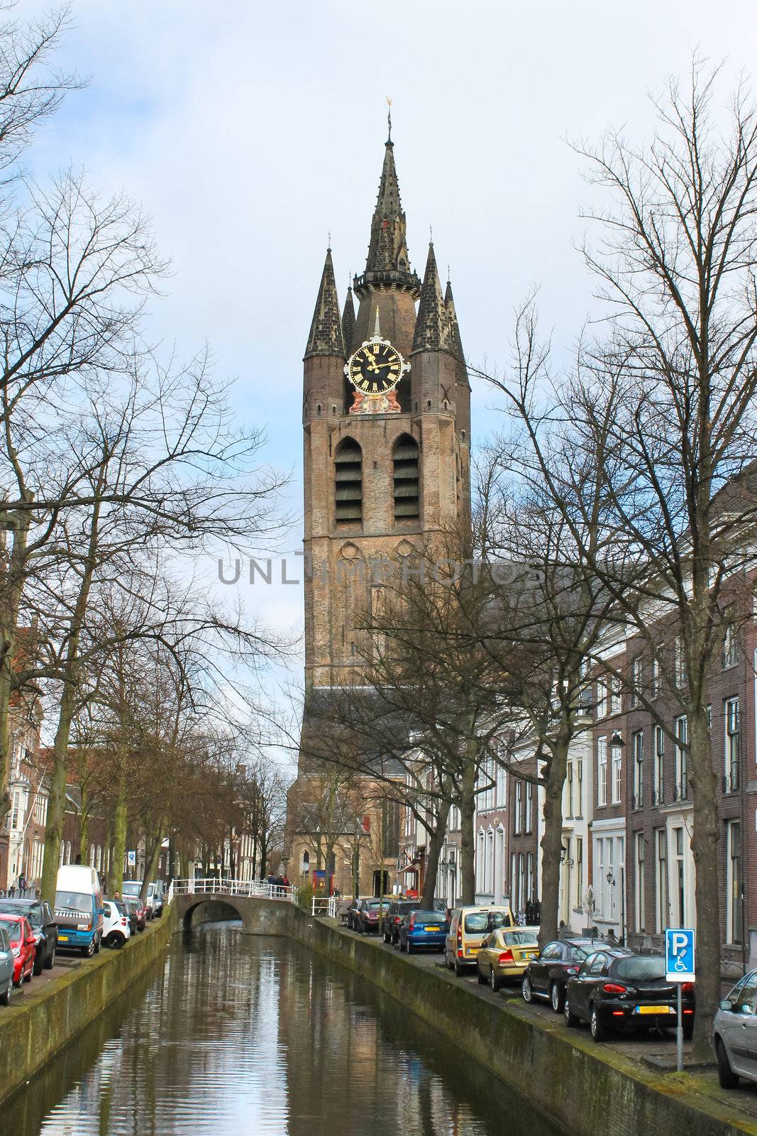 Canal and church tower in Delft, Netherlands by NickNick
