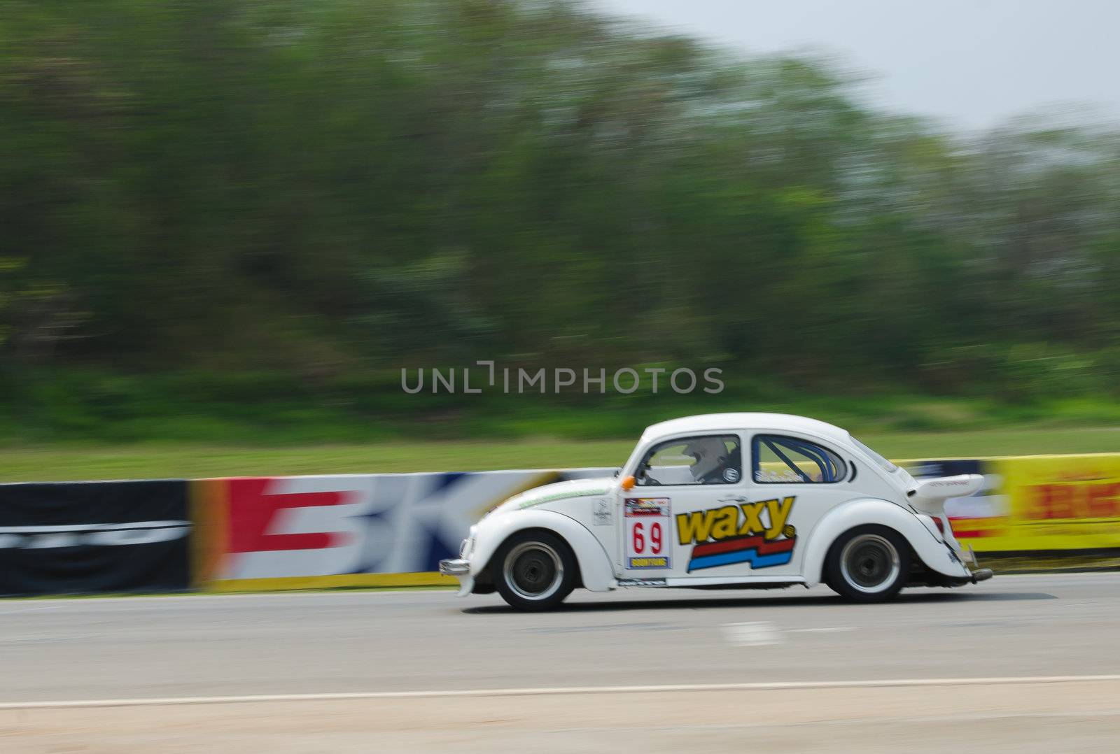 Nakhon Ratchasima, Thailand - March 9th:Unidentified car racing competitors during the "Thailand circuit 2013  " at Bonanza speedway on March 9th, 2013 in Nakhon Ratchasima, Thailand. 