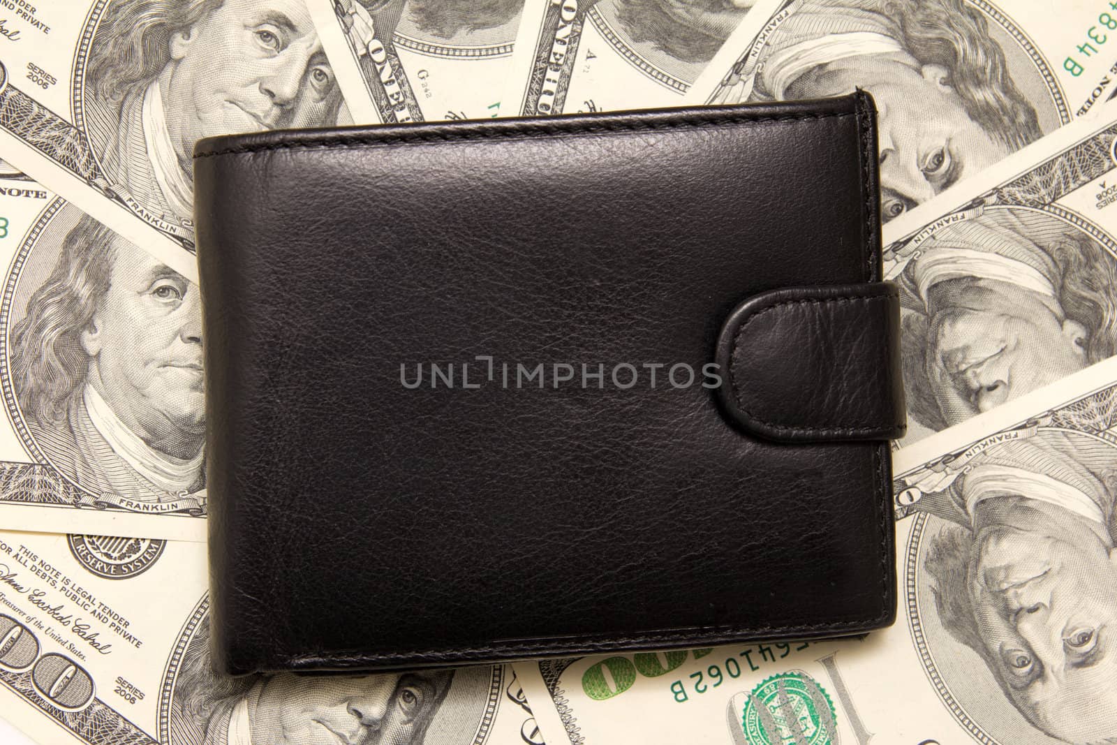 Black purse with money.  by schankz