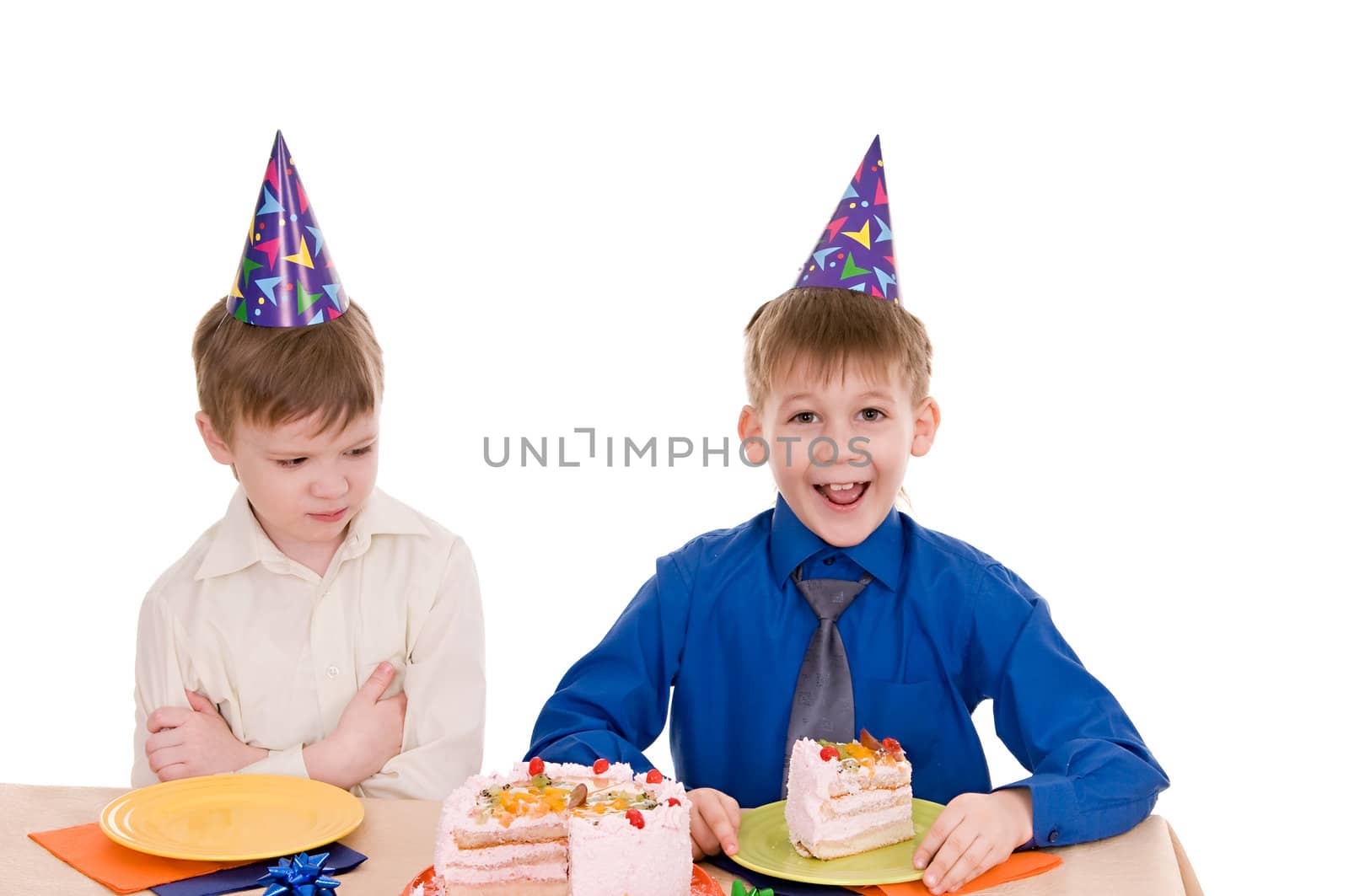 two boys eating a cake isolated on white background
