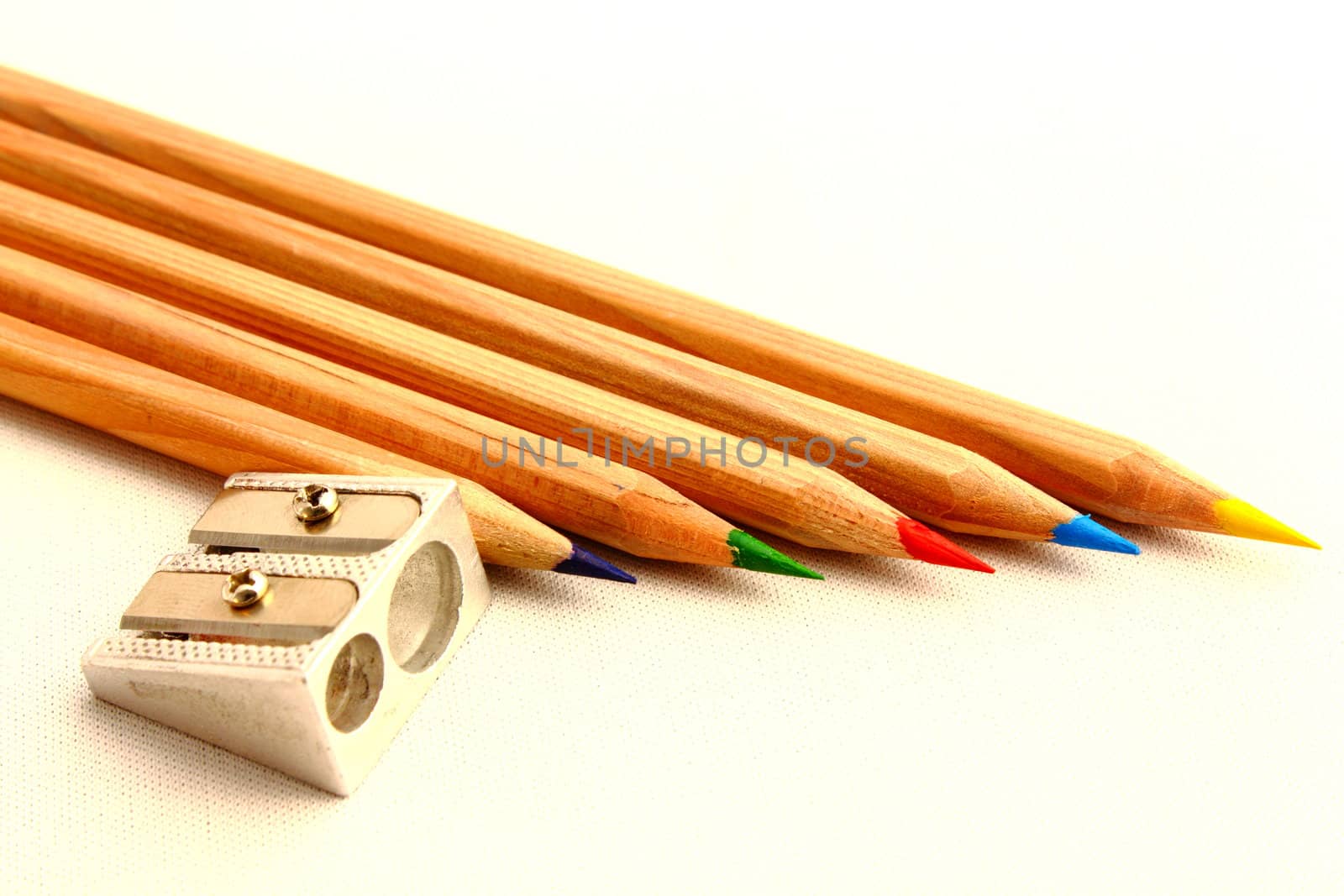 colored crayons and sharpener by taviphoto