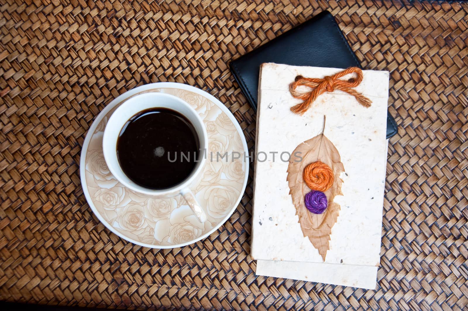 black coffe and paper notebook by buffaloboy