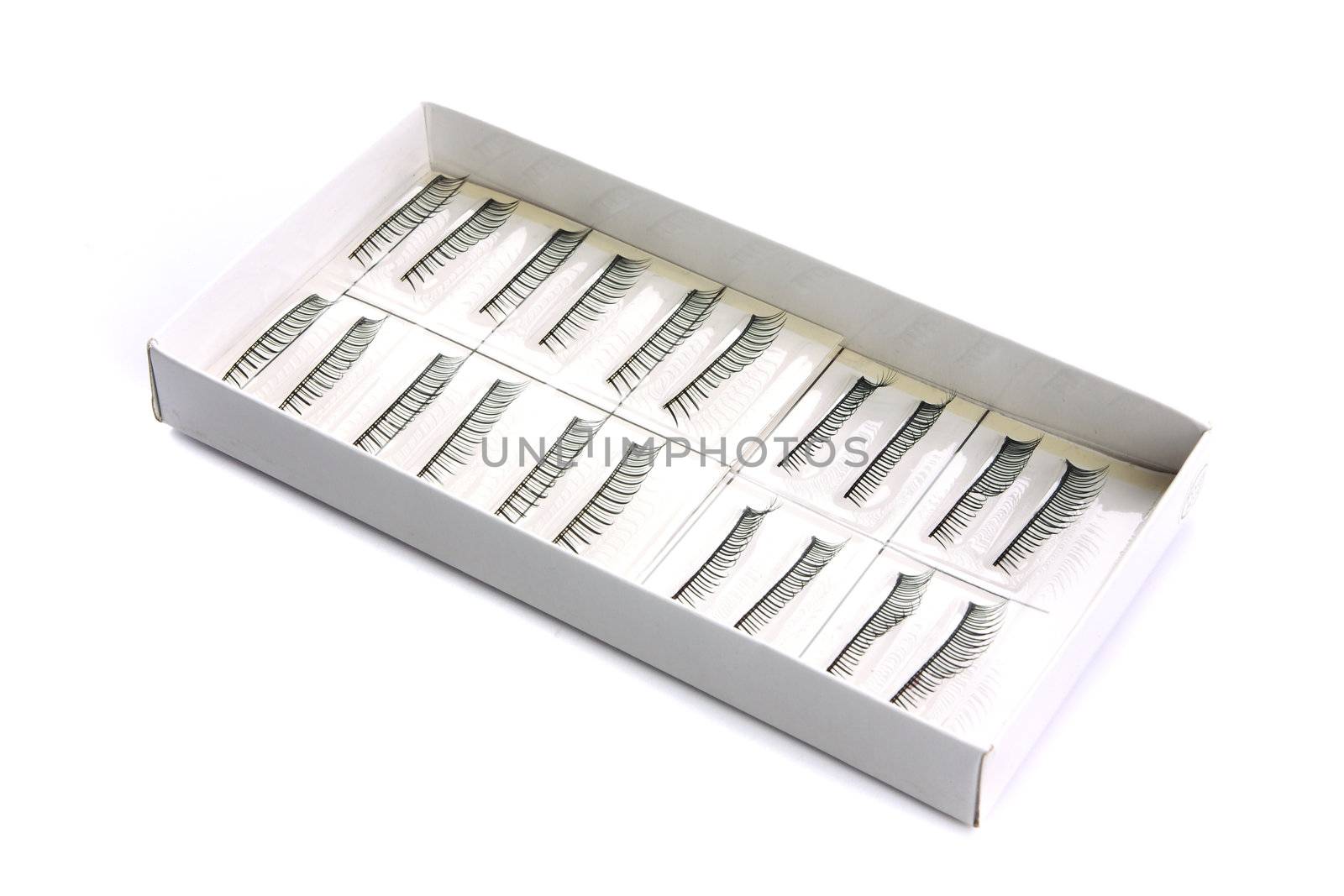 false eyelashes in the carton on white background