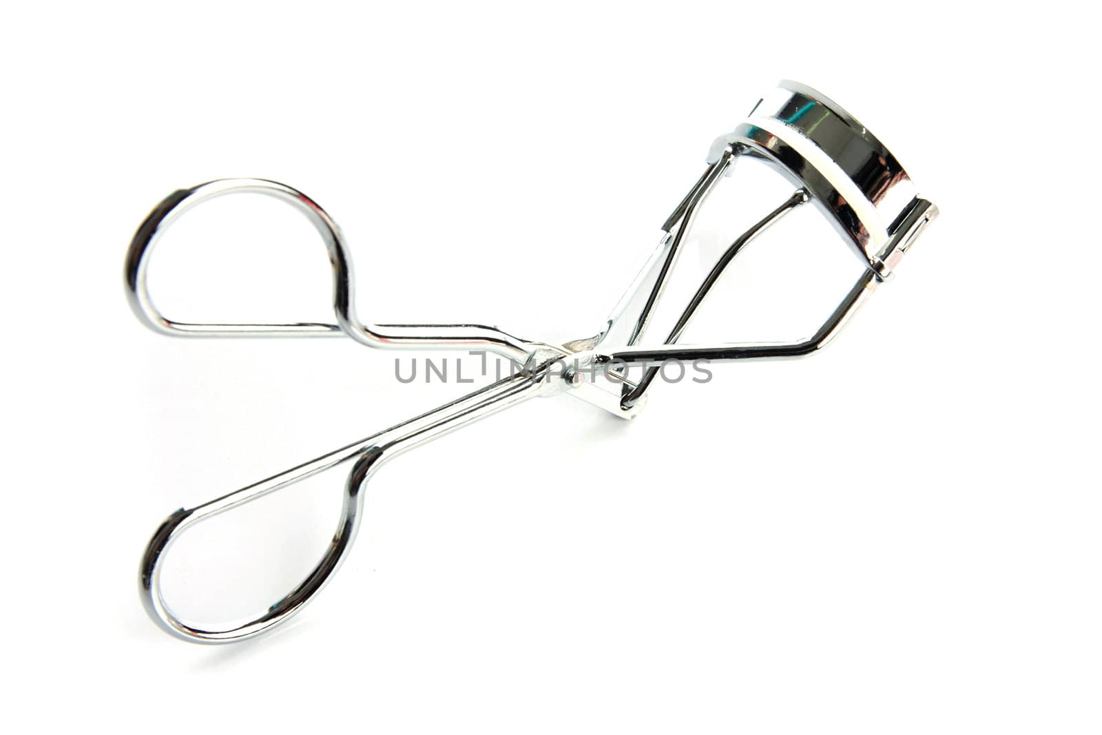 Eyelash curler on the white background