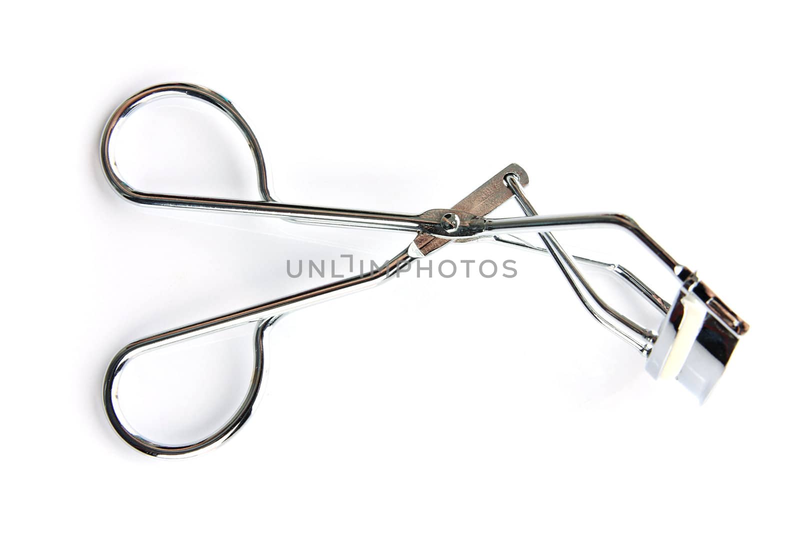 Eyelash curler on the white background