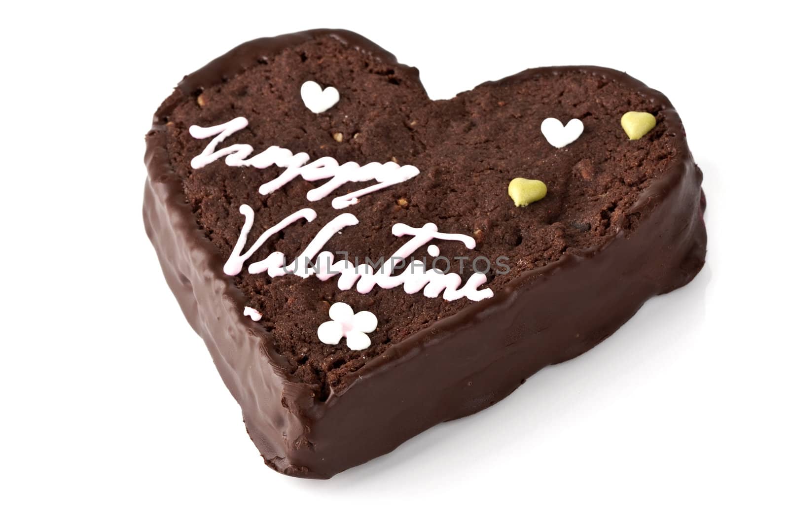 Heart shaped slice of a brownie on white background