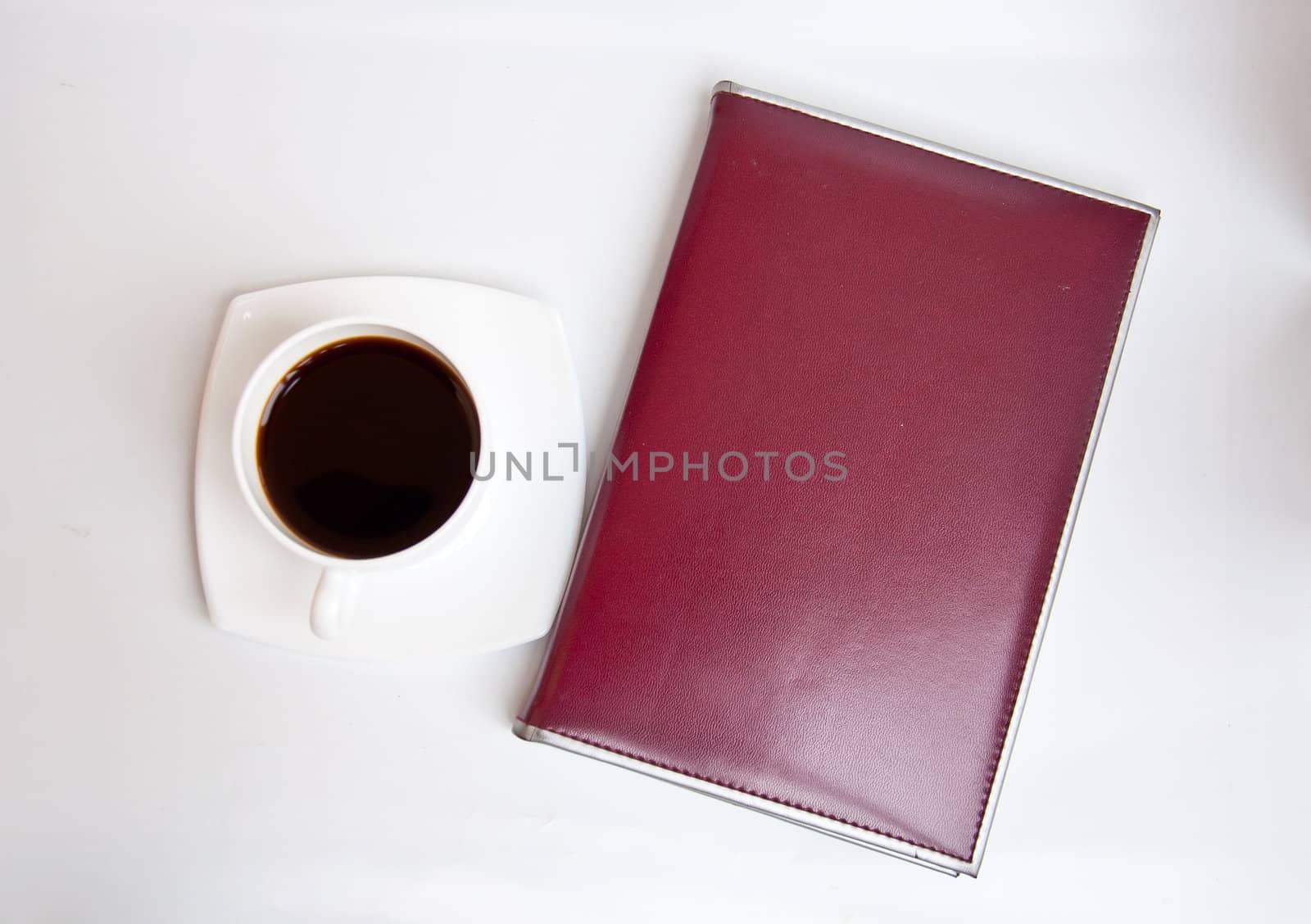 black coffe and brown notebook by buffaloboy