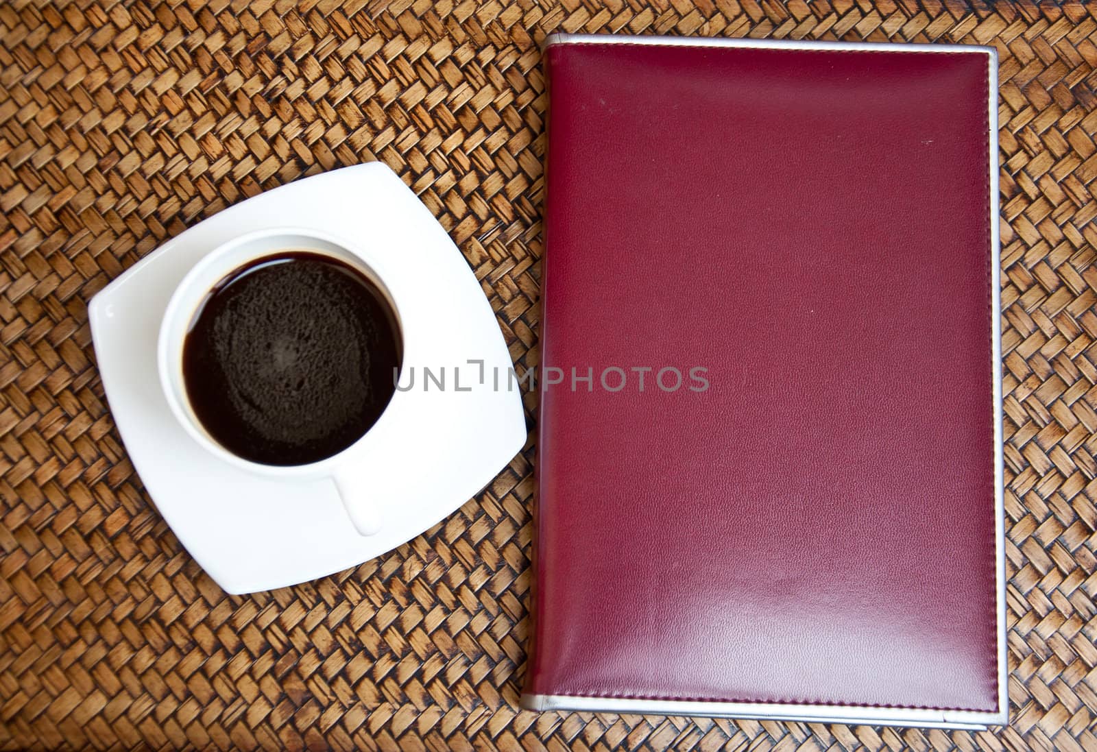 blank paper and black coffee on sedge background