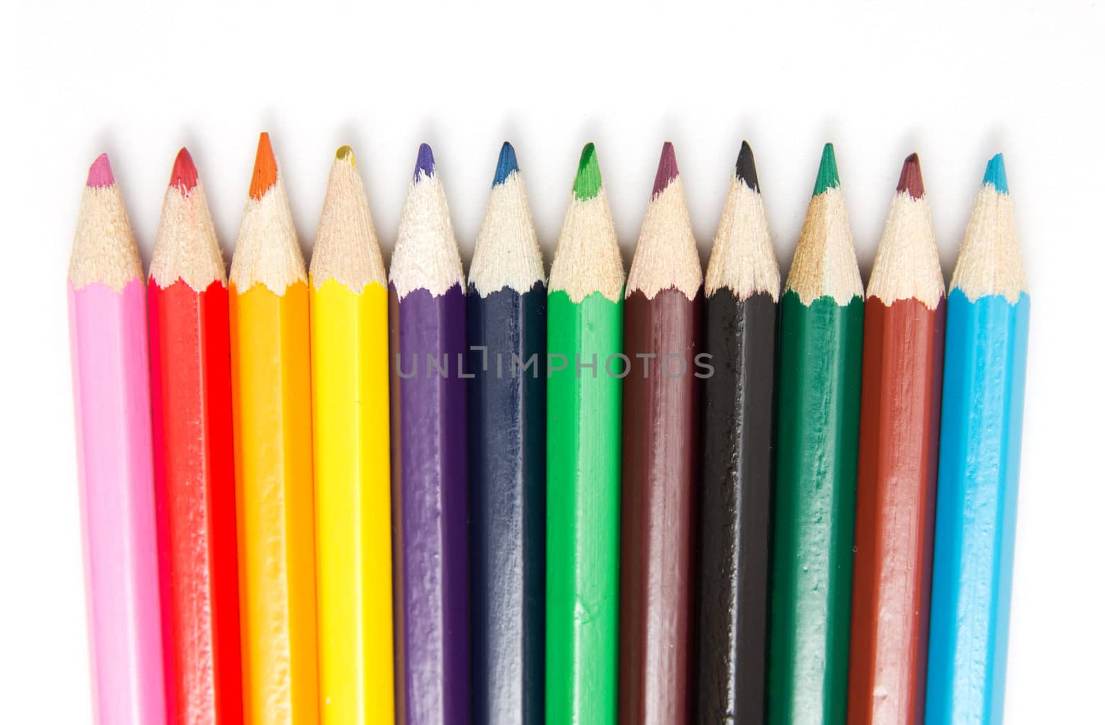 Colour pencils isolated on white background close up  by schankz