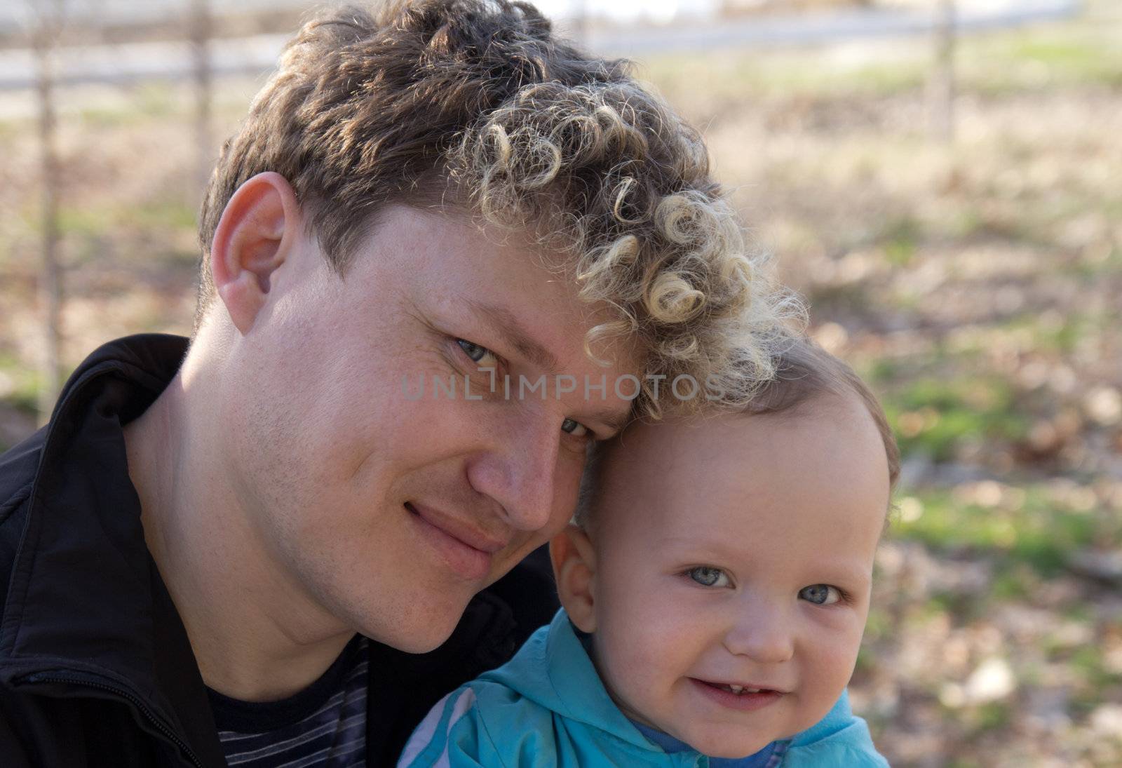 an infant with his father on the nature