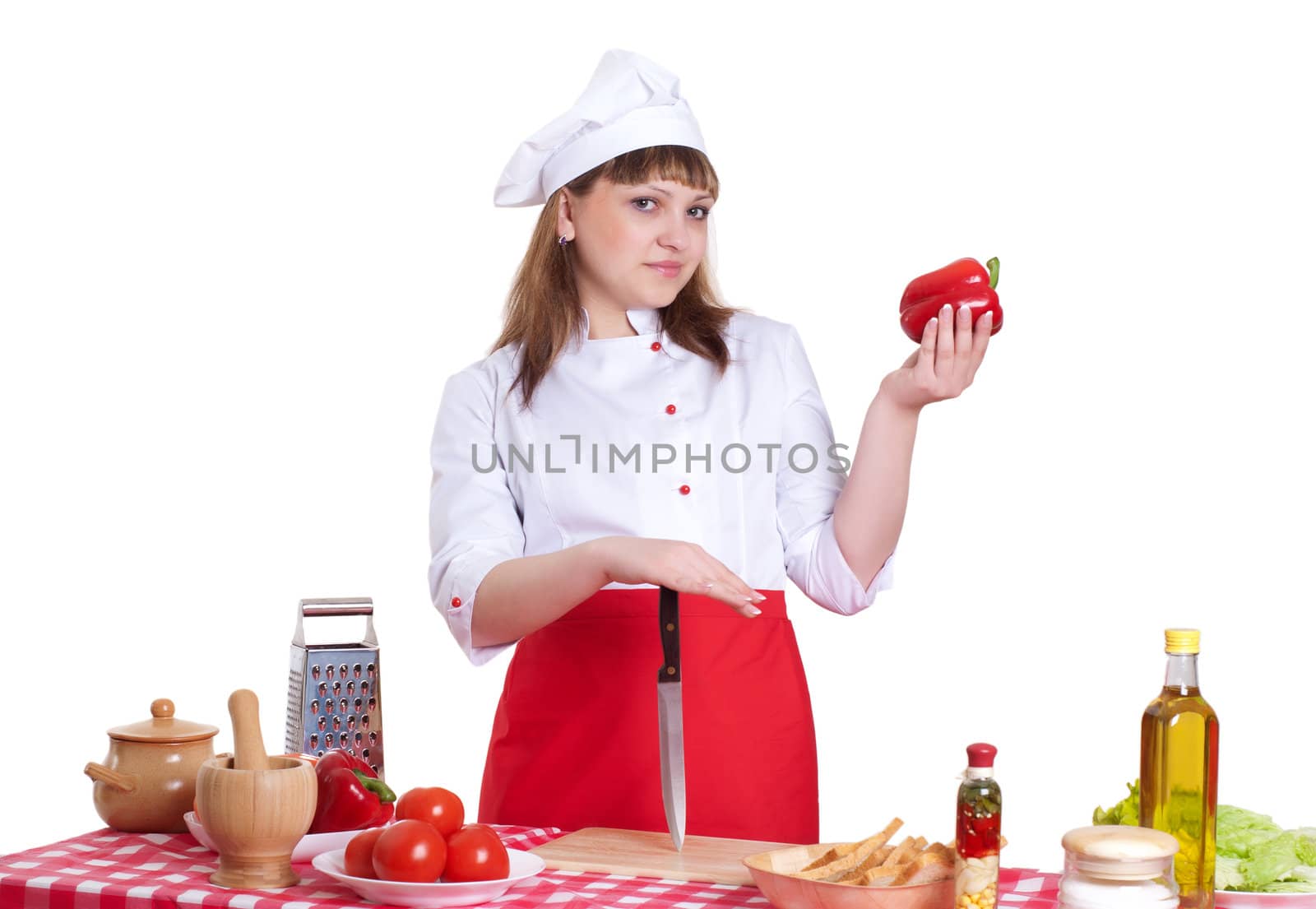 attractive woman cuts vegetables and cooking dinner