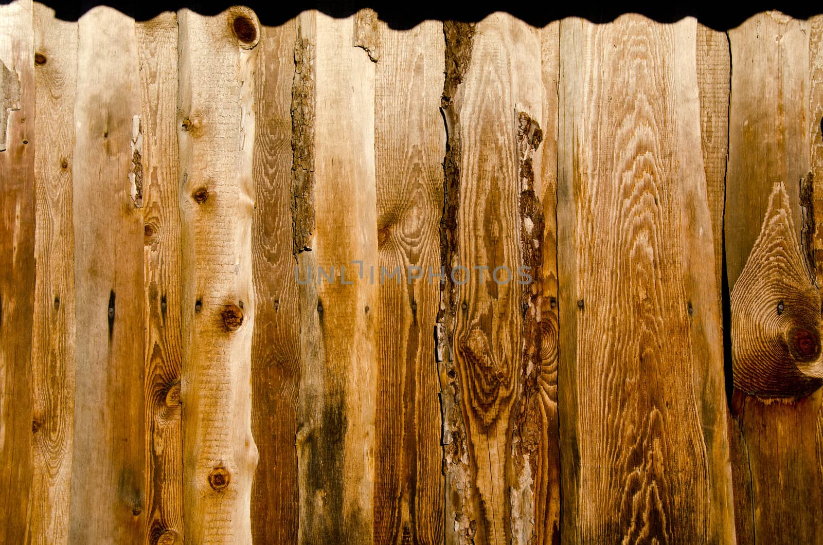 Background of wall made of ancient plank board. Retro vintage grungy building backdrop.