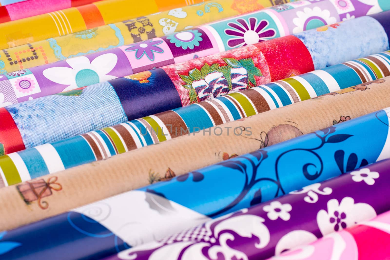 Rolls of colored wrapping paper.