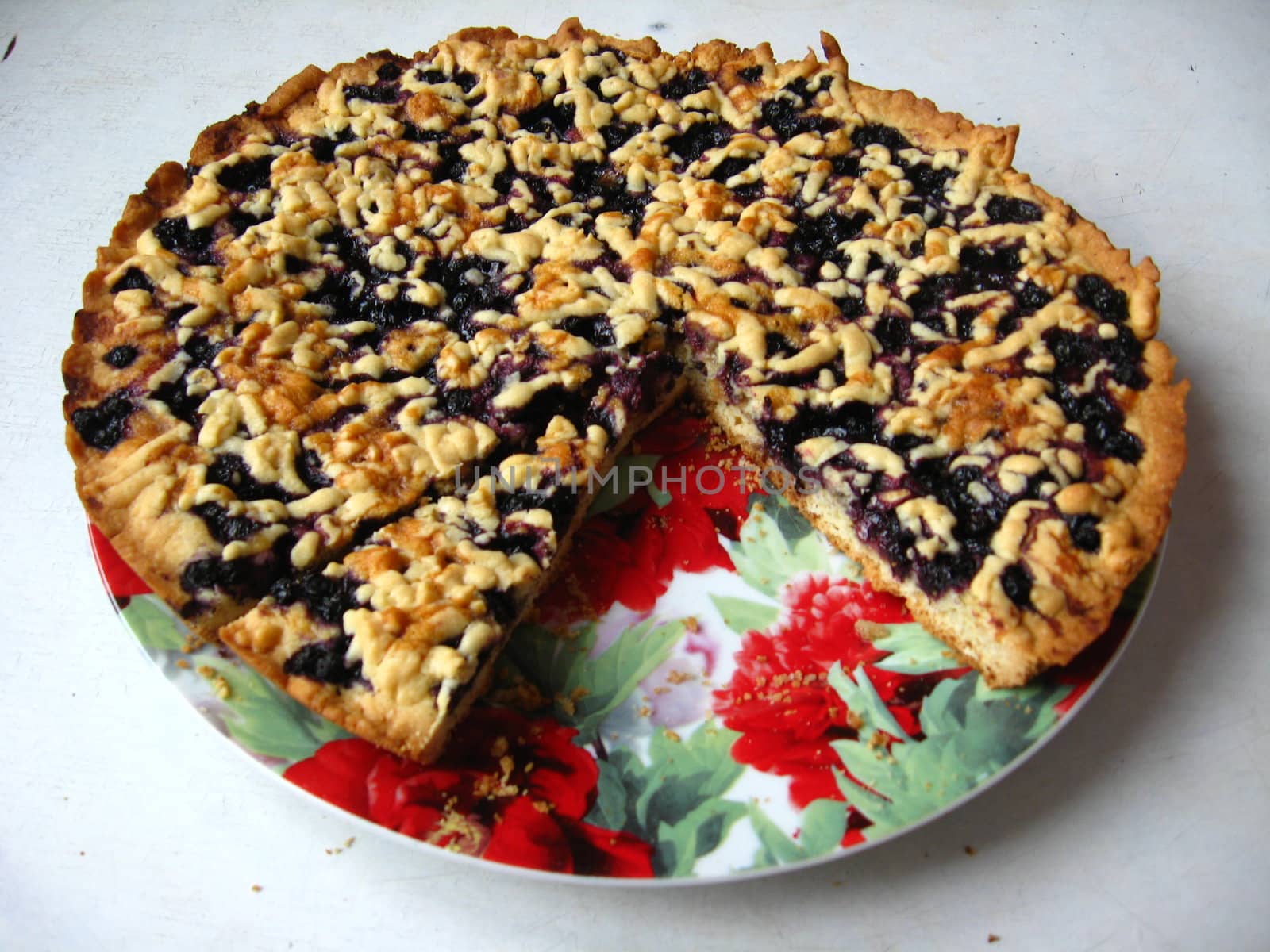 Fresh and tasty pie with bilberry isolated on the white background