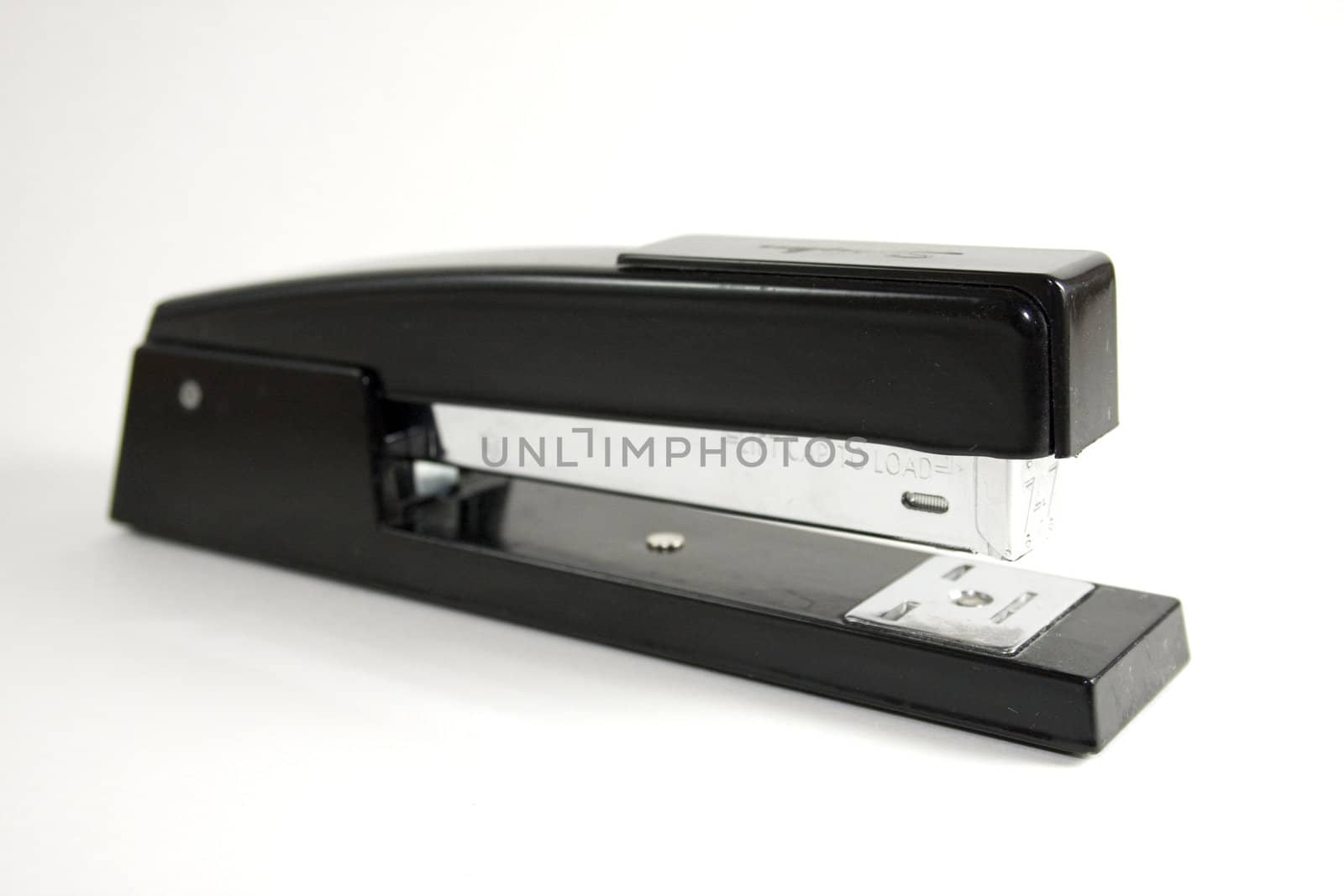 Black stapler on white background