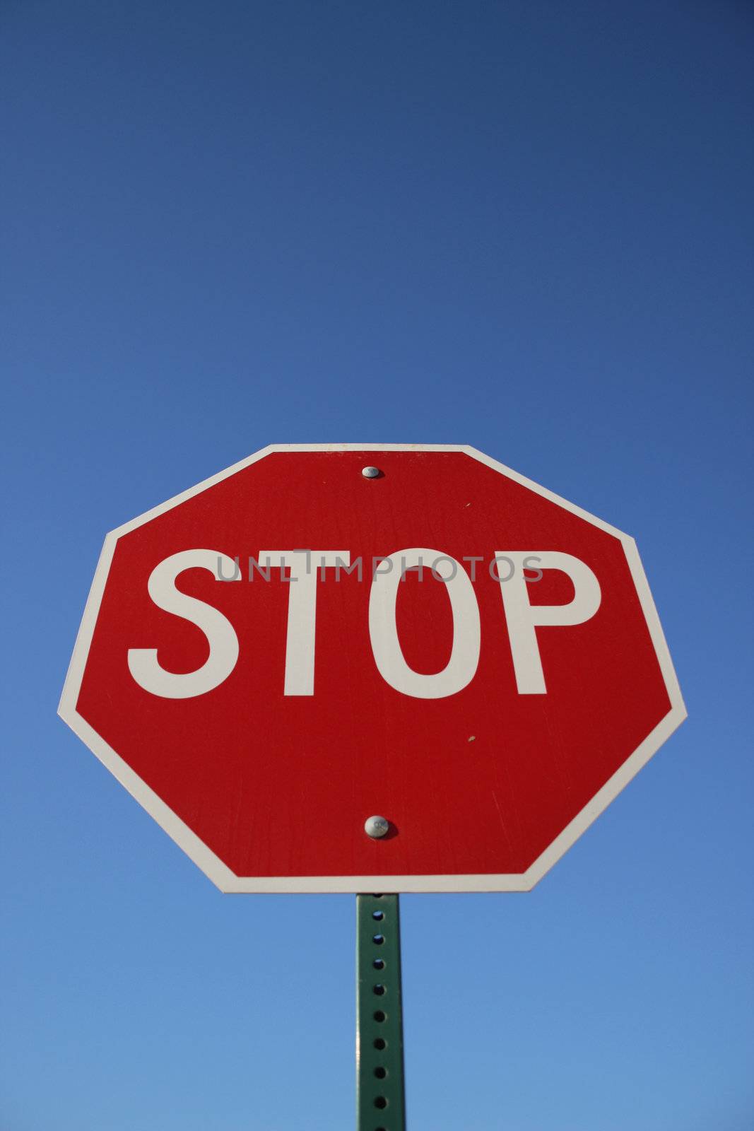 Stop Sign against blue sky background