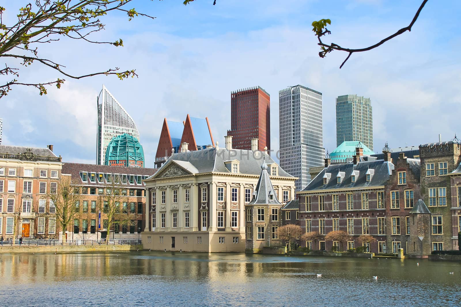 Binnenhof Palace - Dutch Parlamen against the backdrop of modern buildings. Den Haag, Netherlands. 