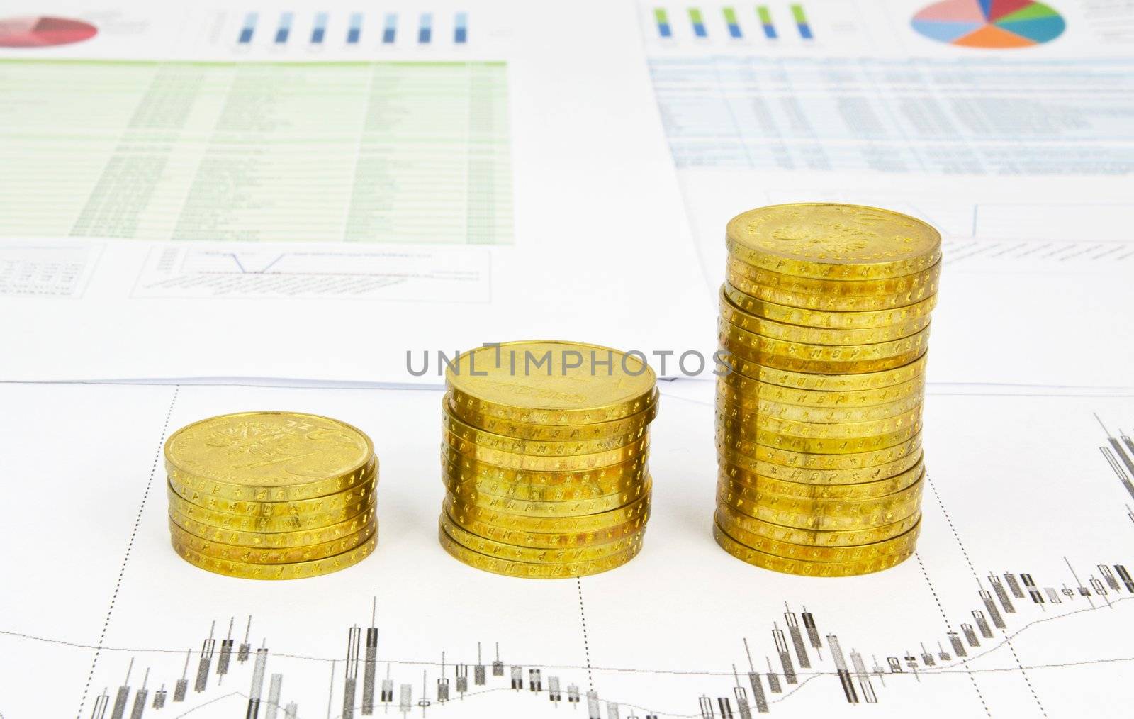 Golden coins stack on business background