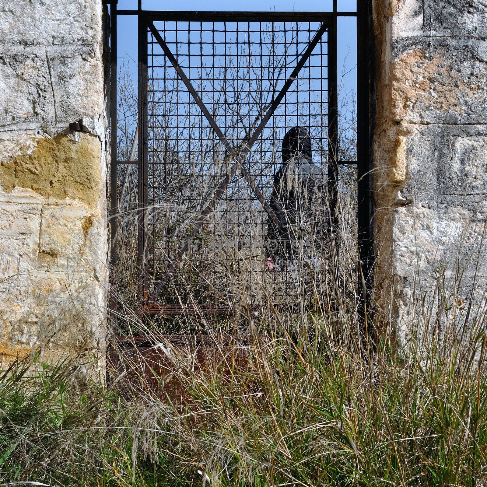 man behind vintage metal door by sirylok