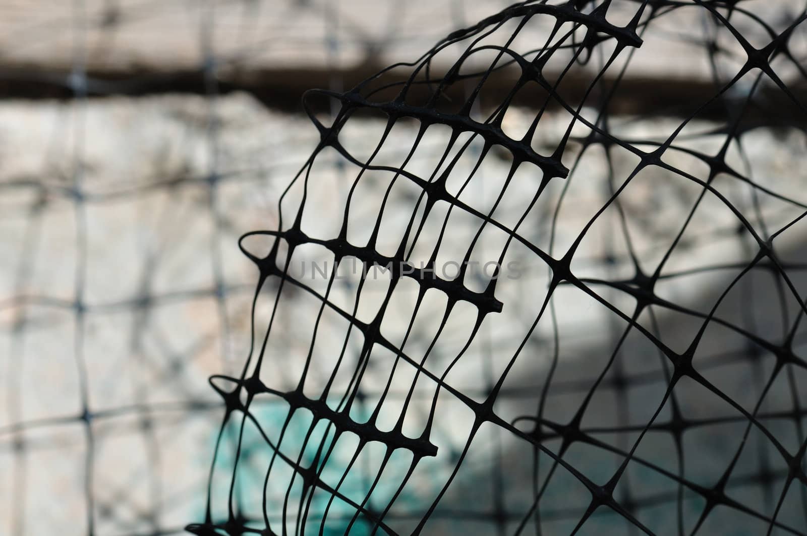 Plastic wire fence used in construction macro. Abstract background.