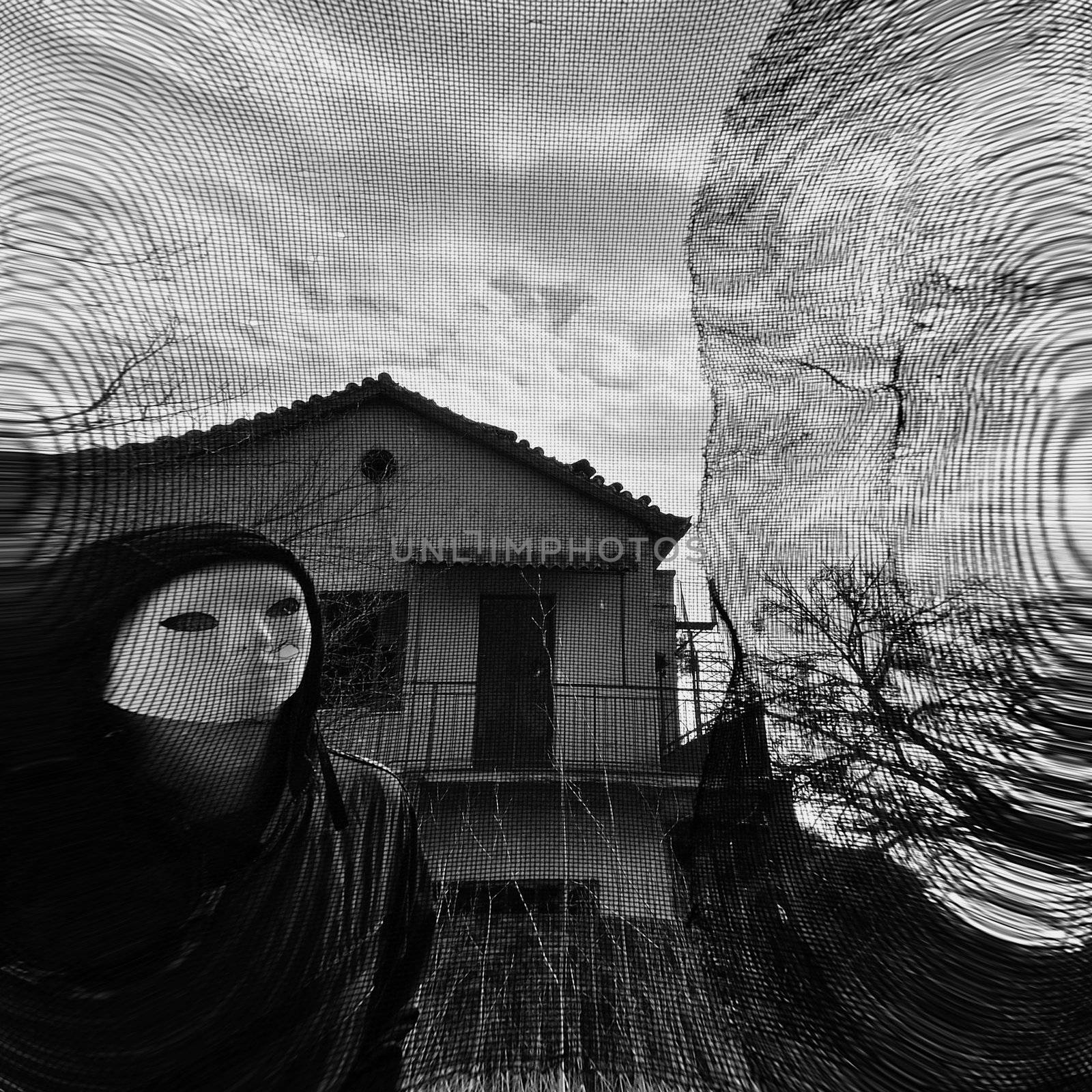 Masked figure behind threaded window. Black and white.