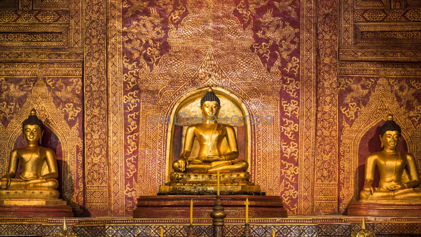 "Phra Sihing Buddha" Thai gold statues at Phra Singh Temple by nuttakit