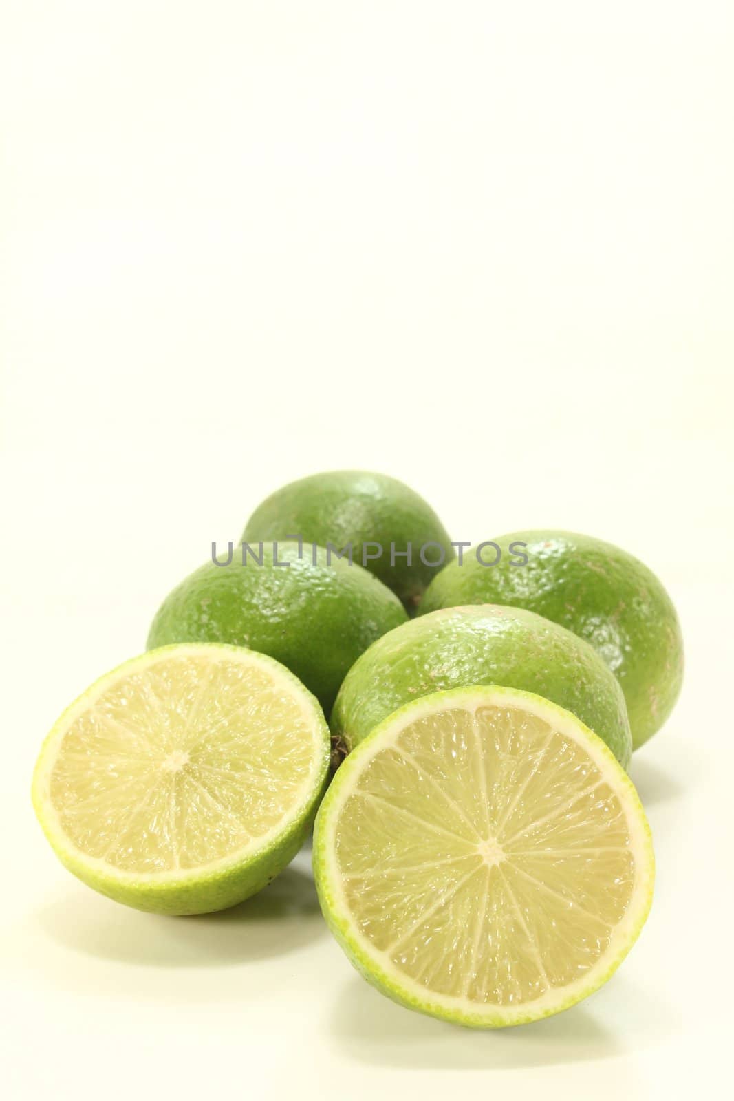 fresh green, juicy sliced and whole limes