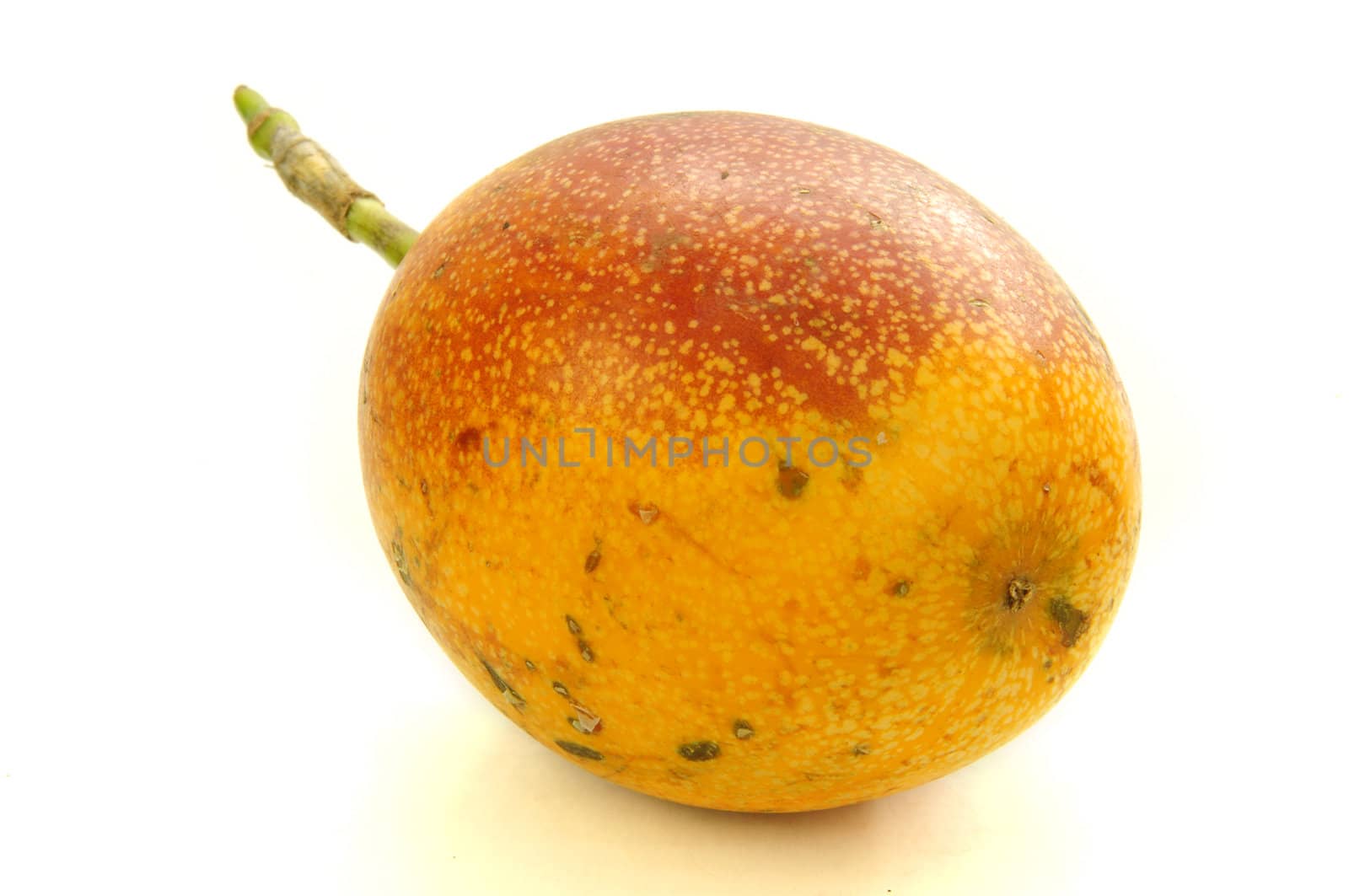 Whole uncut granadilla fruit isolated on white