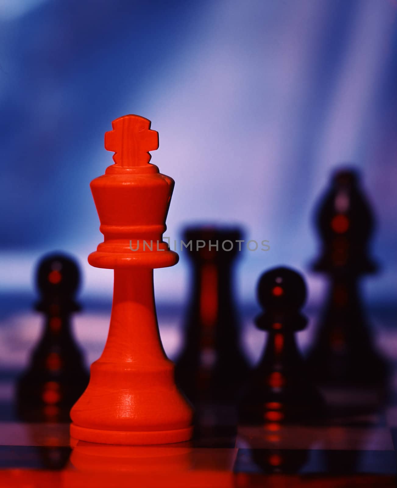 Chess pieces with dramatic lighting