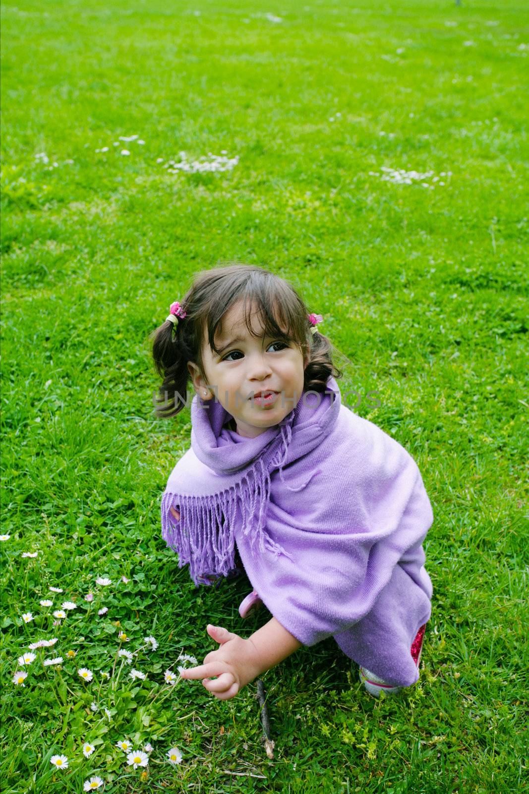 beautiful girl playing on green grass, summer