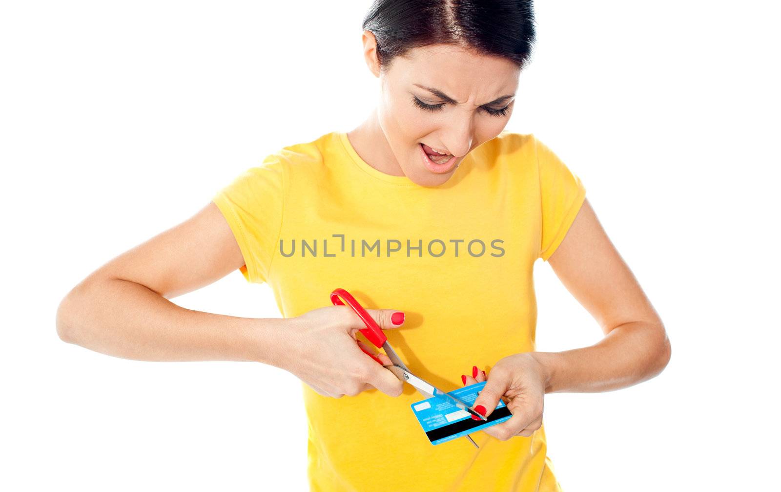 Unhappy female customer destroying her atm card by stockyimages