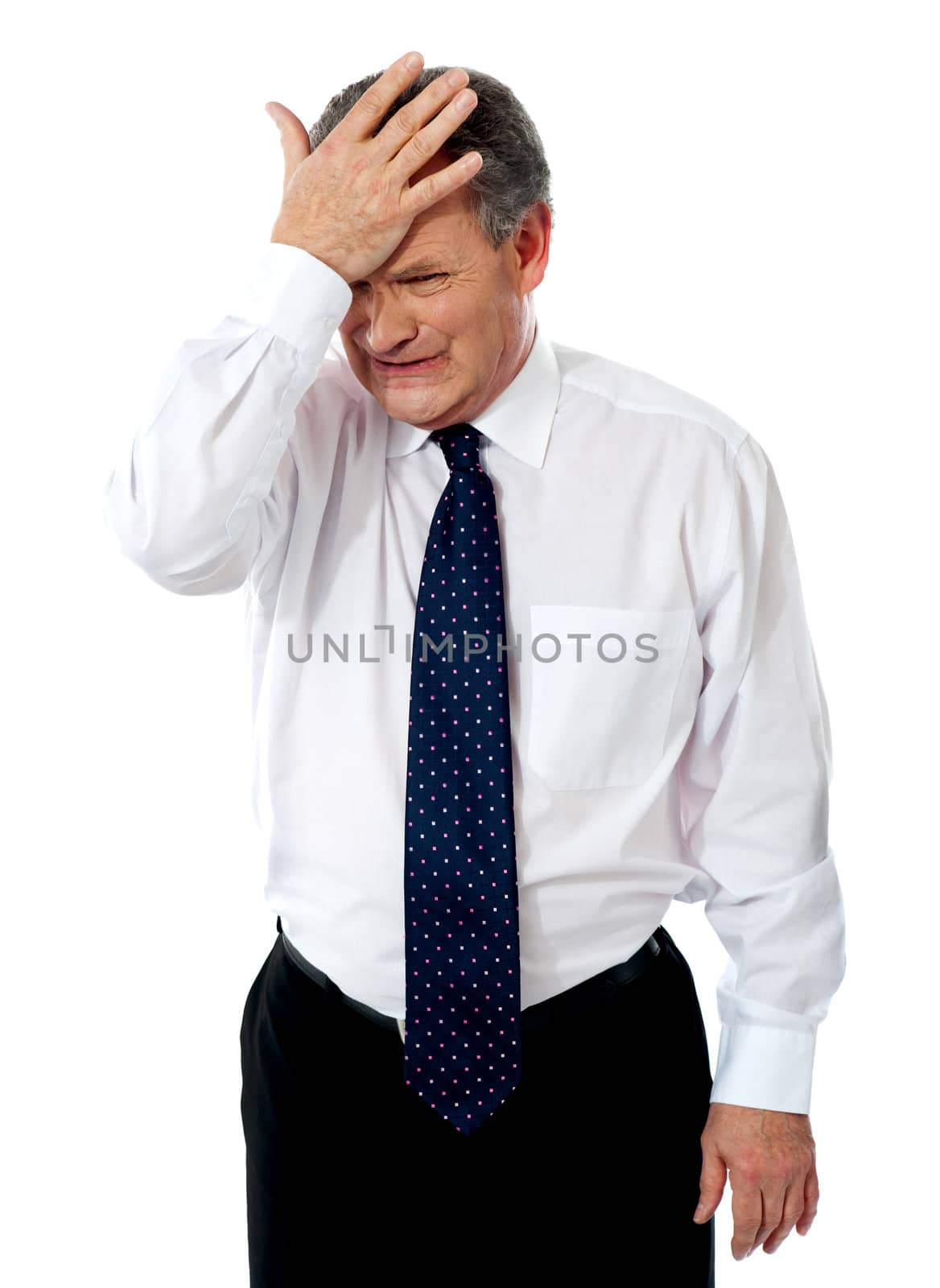 Sad old corporate man with hand on head isolated against white background