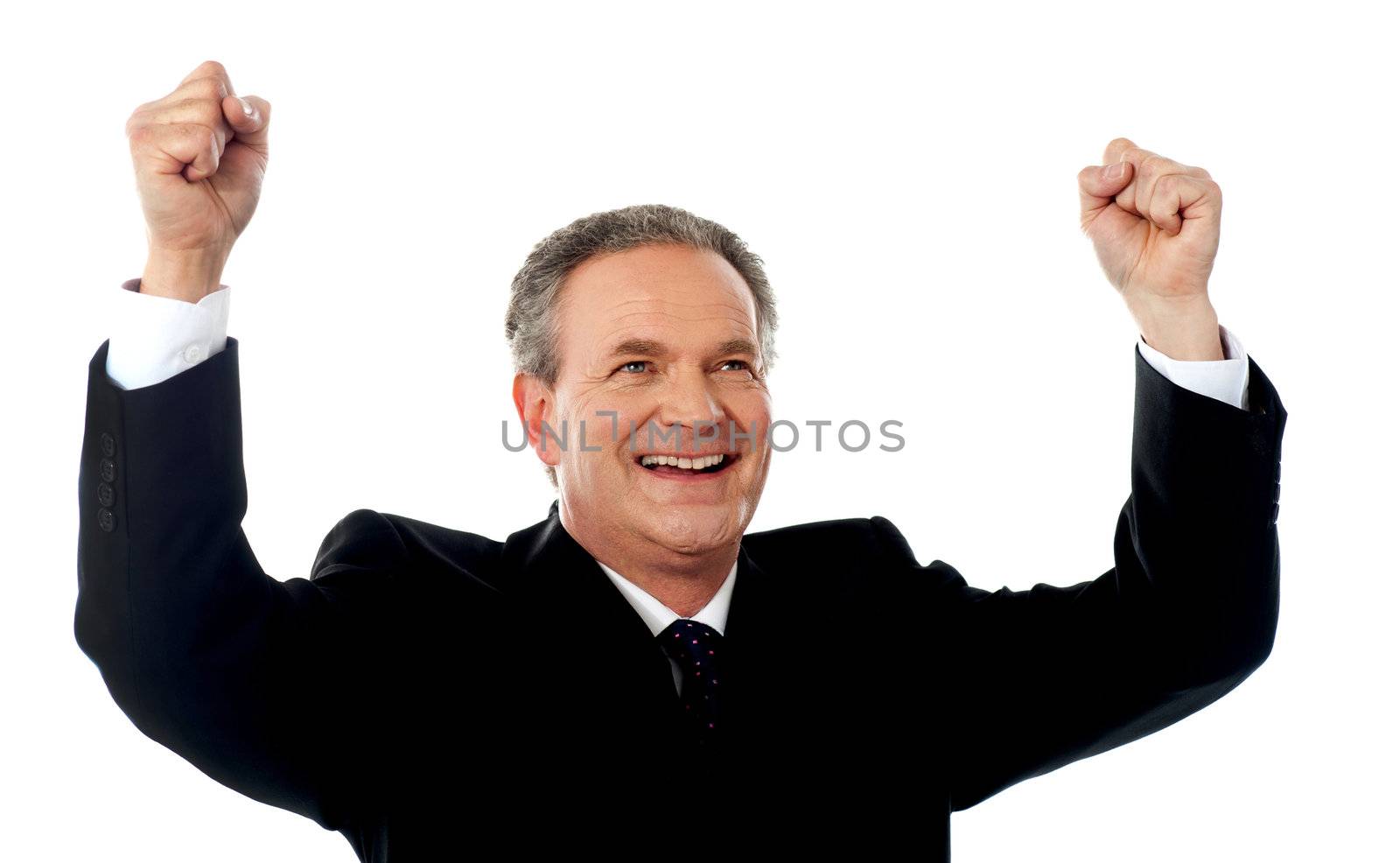 Successful old businessman rejoicing in excitement with arms up